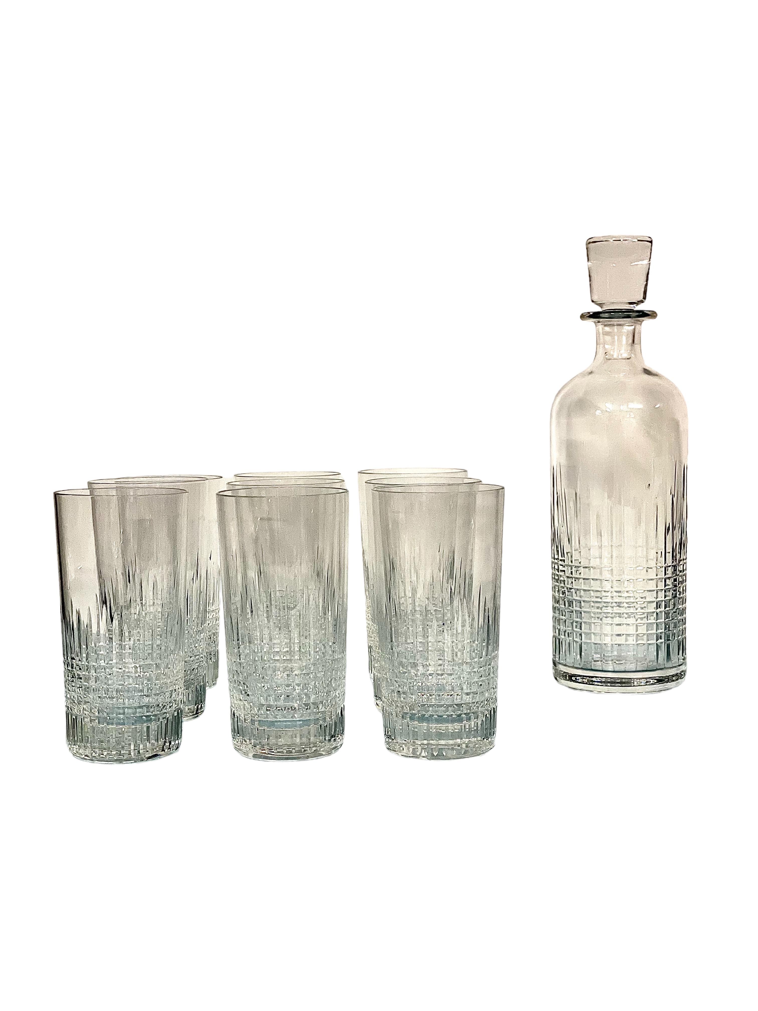 A very stylish set of nine Baccarat highball glasses, beautifully cut from fine clear crystal in the 'Nancy' pattern, which was first produced in 1909. Each of these glasses feels ultra-luxurious to hold, with the textural feeling of the diamond-cut
