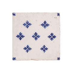 Set of 9 Delft tiles in cobalt pattern of florets, c. 1600’s