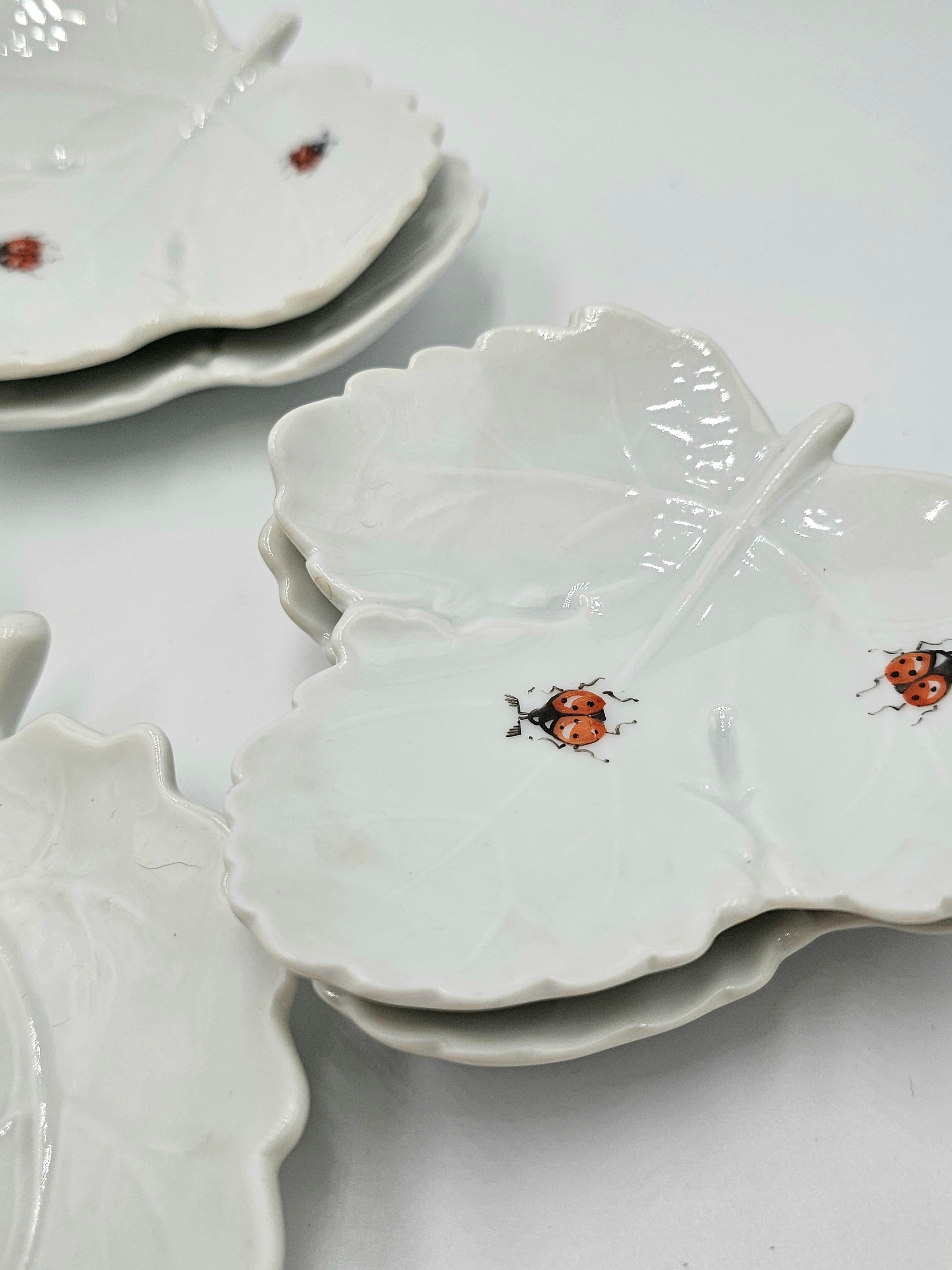 Set of 9 porcelain dishes. Each is hand painted with 2 ladybugs.
Stamped in the bottom Ludwigsburg. 
Ludwigsburg porcelain was a famous porcelain manufacturer in Germany .
2 seizes of dishes. 1 large dish 14x15 cm, the 8 small dishes 9x9 cm.
1 small