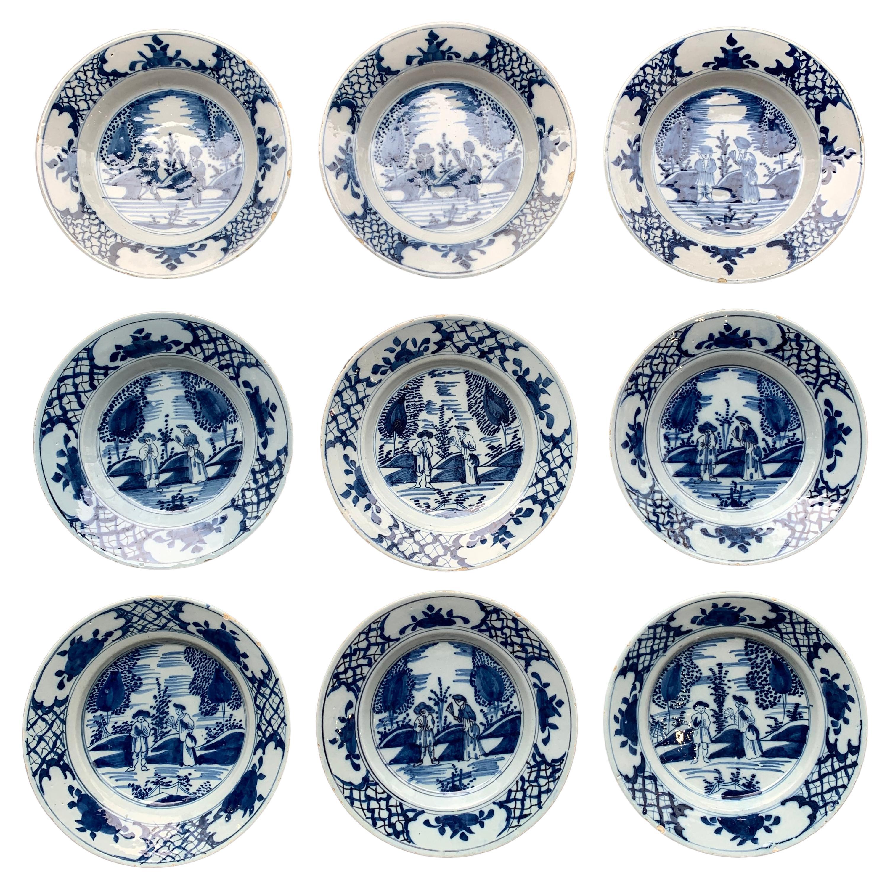 Set di 9 piatti Delft olandesi con coppie, XVIII secolo