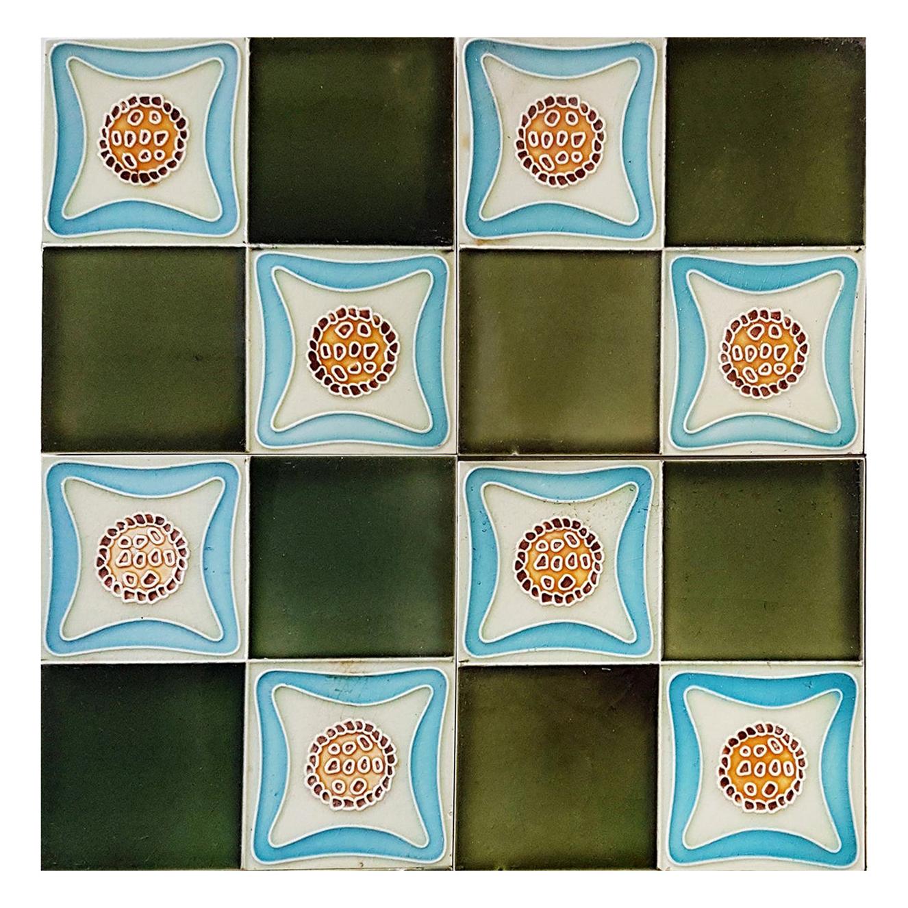 Recently lifted from its original home, this unique and antique set of Art Deco handmade tiles. A beautiful relief and color. With stylized design. These tiles would be charming displayed on easels, framed or incorporated into a custom tile