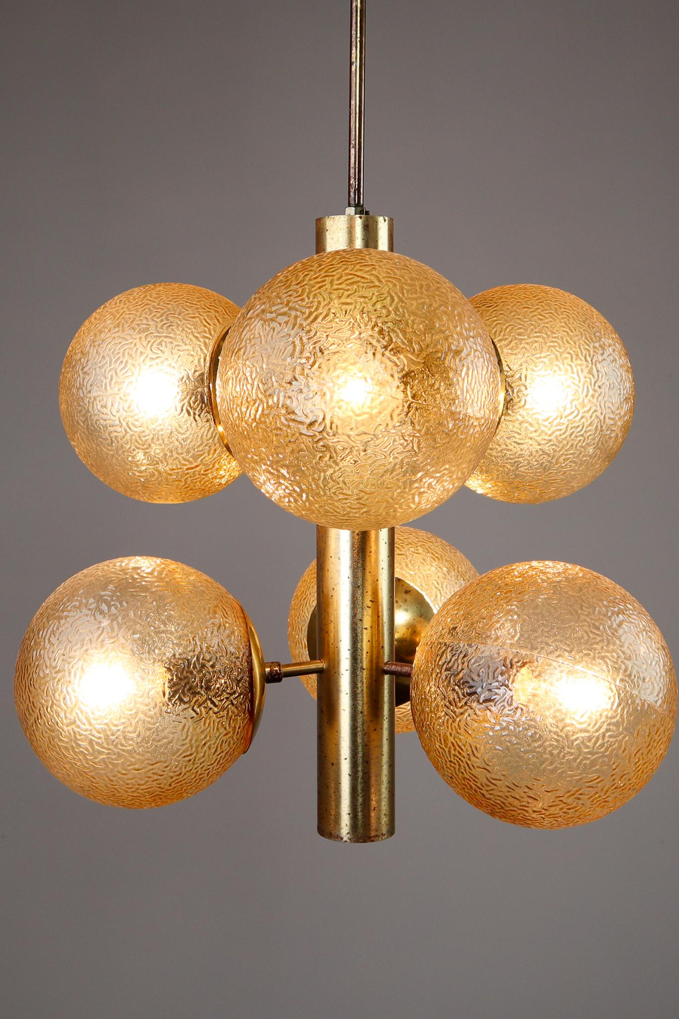 Set of 9 Sputnik chandeliers with 6 handmade glass globes and patinated brass by Kaiser Leuchten, Germany, 1960s.These chandeliers will contribute to a luxurious character of the (hotel-bar) interior. Very good vintage condition without damages.