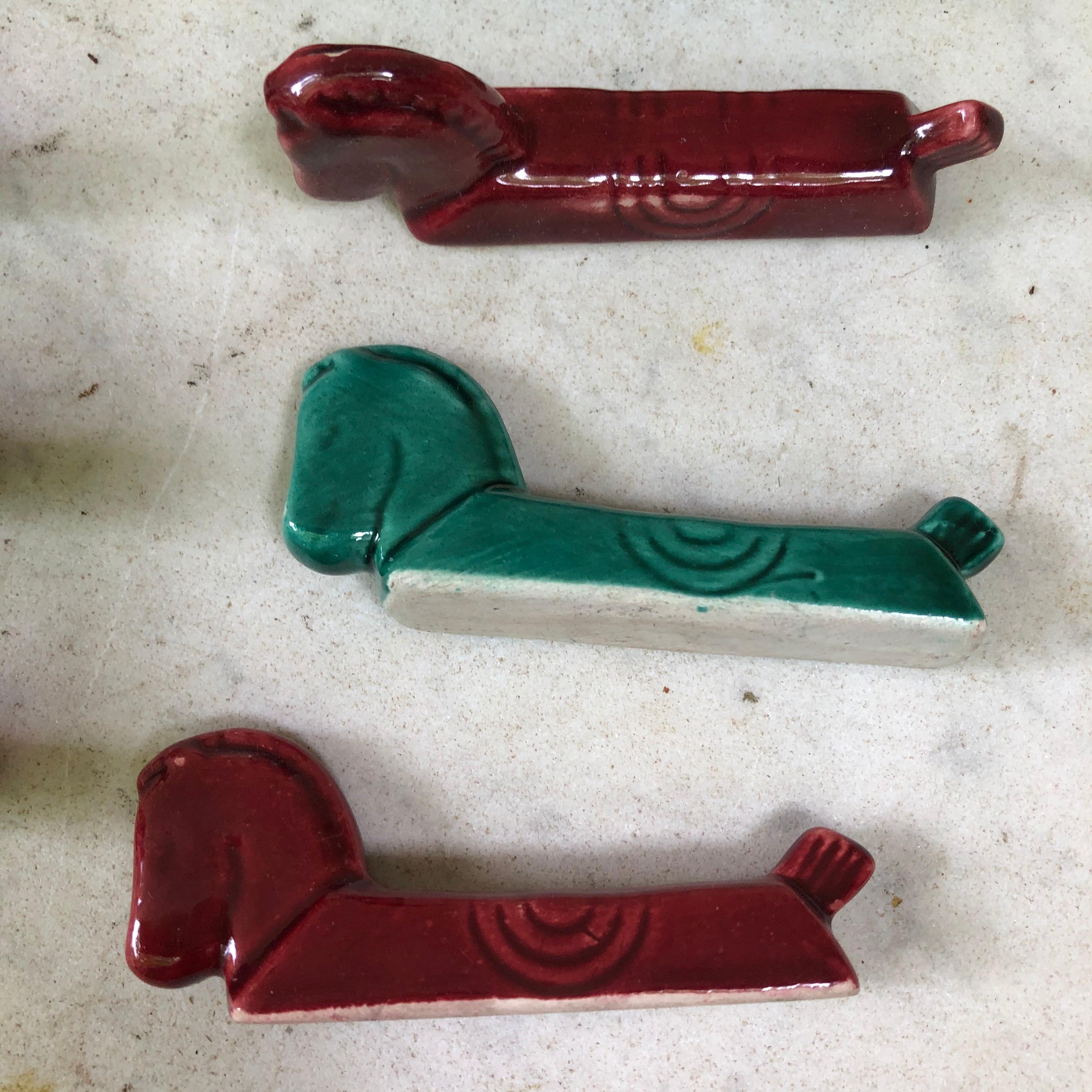 Set of nine French Majolica horse knife rests, circa 1950.
Art Deco style.

 
