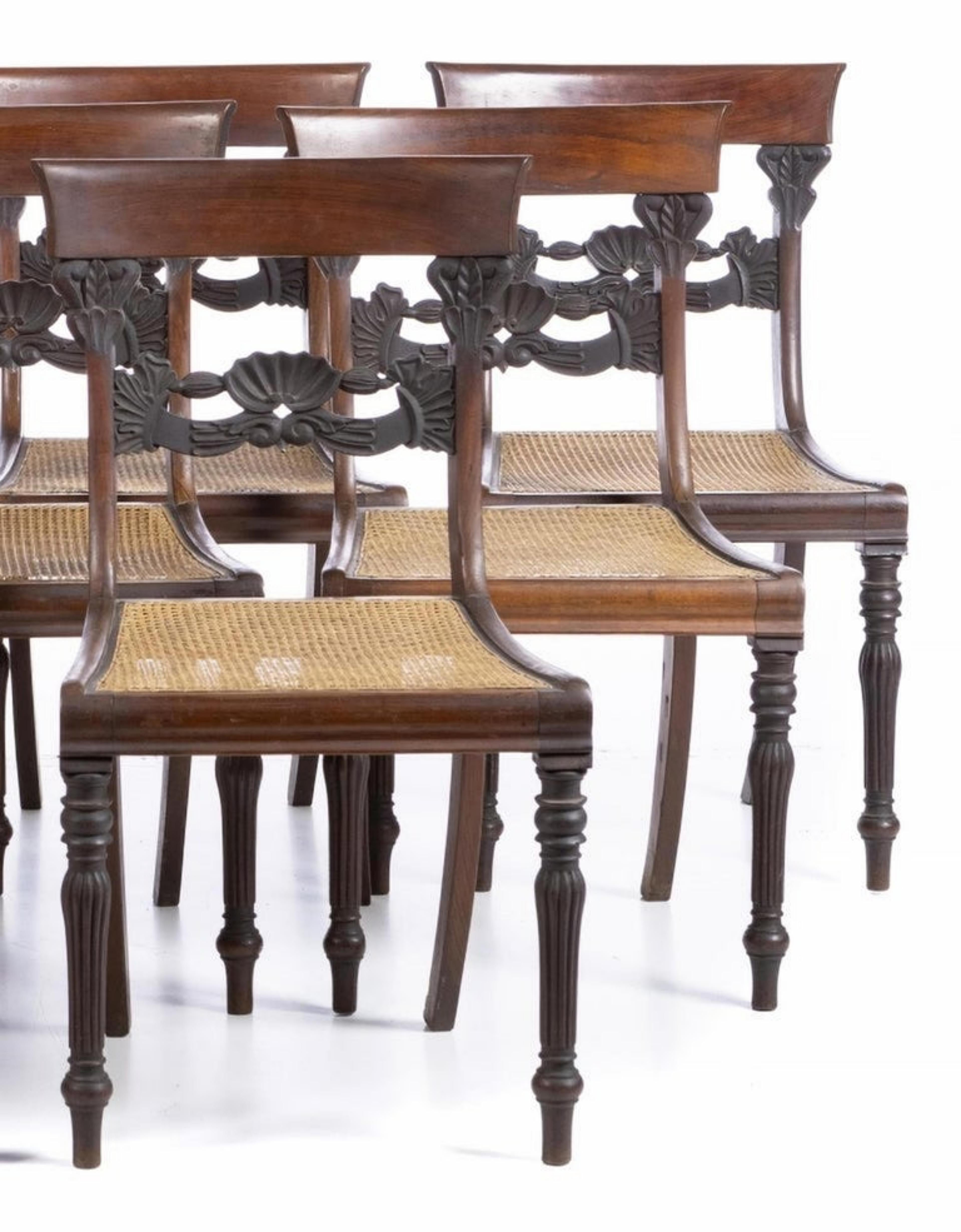 Set of 9 chairs
Portuguese, 19th century in oilwood wood, cane seats, hollow back. 
Small defects and signs of use. 
Dimension: 88 x 47 x 43 cm.