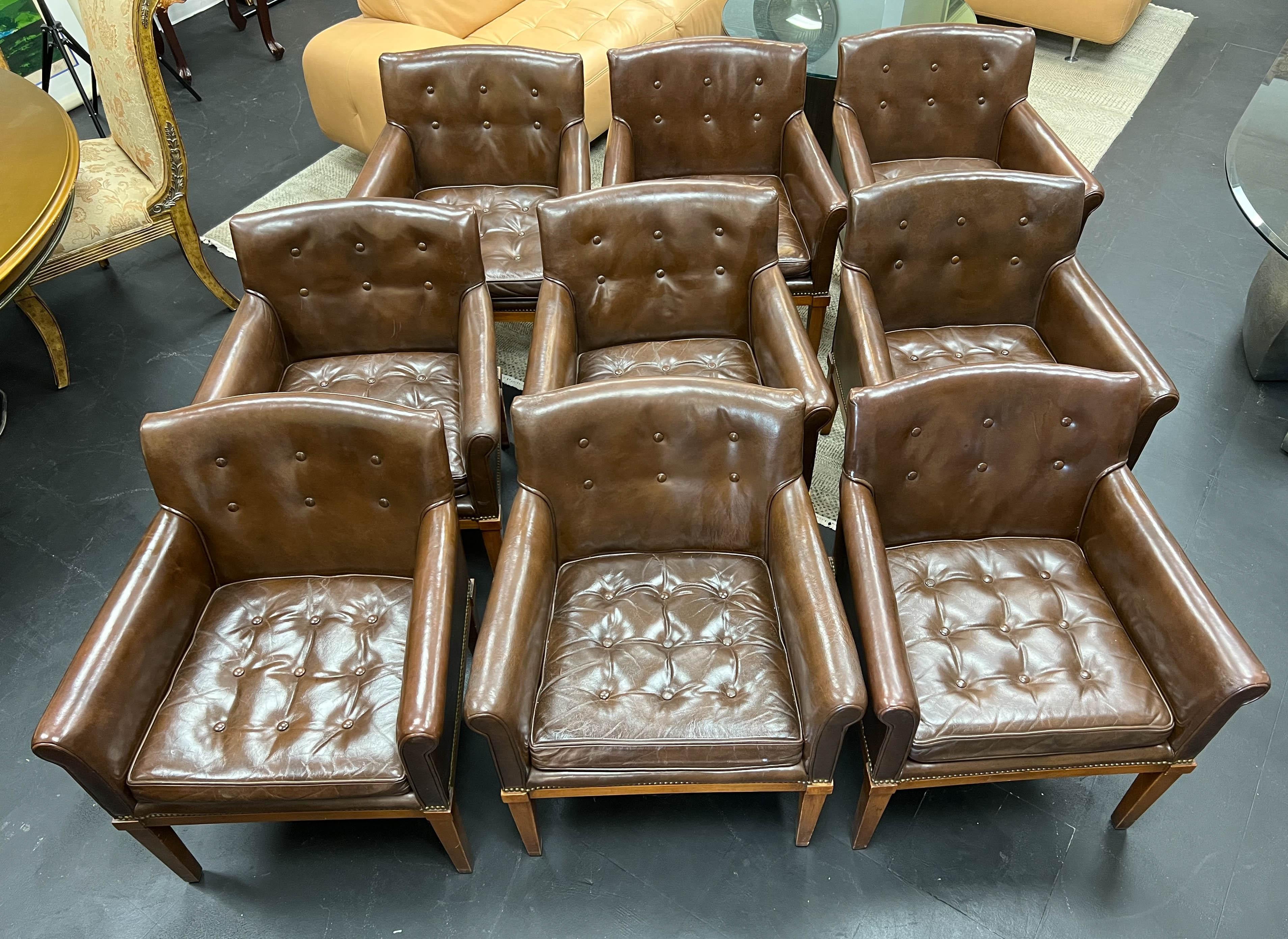Set of nine brown leather armchairs by Ralph Morse Furniture Company in Grand Rapids, Michigan, made in 1969. Worn beautifully, the chairs are comfortable and the perfect size and scale in a living room or office/library around a conference table,