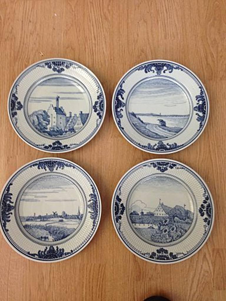 Set of nine Royal Copenhagen unique dinner plates from Bonnesen service from 1916. Measures: 24.7 cm. Motifs from different cities.