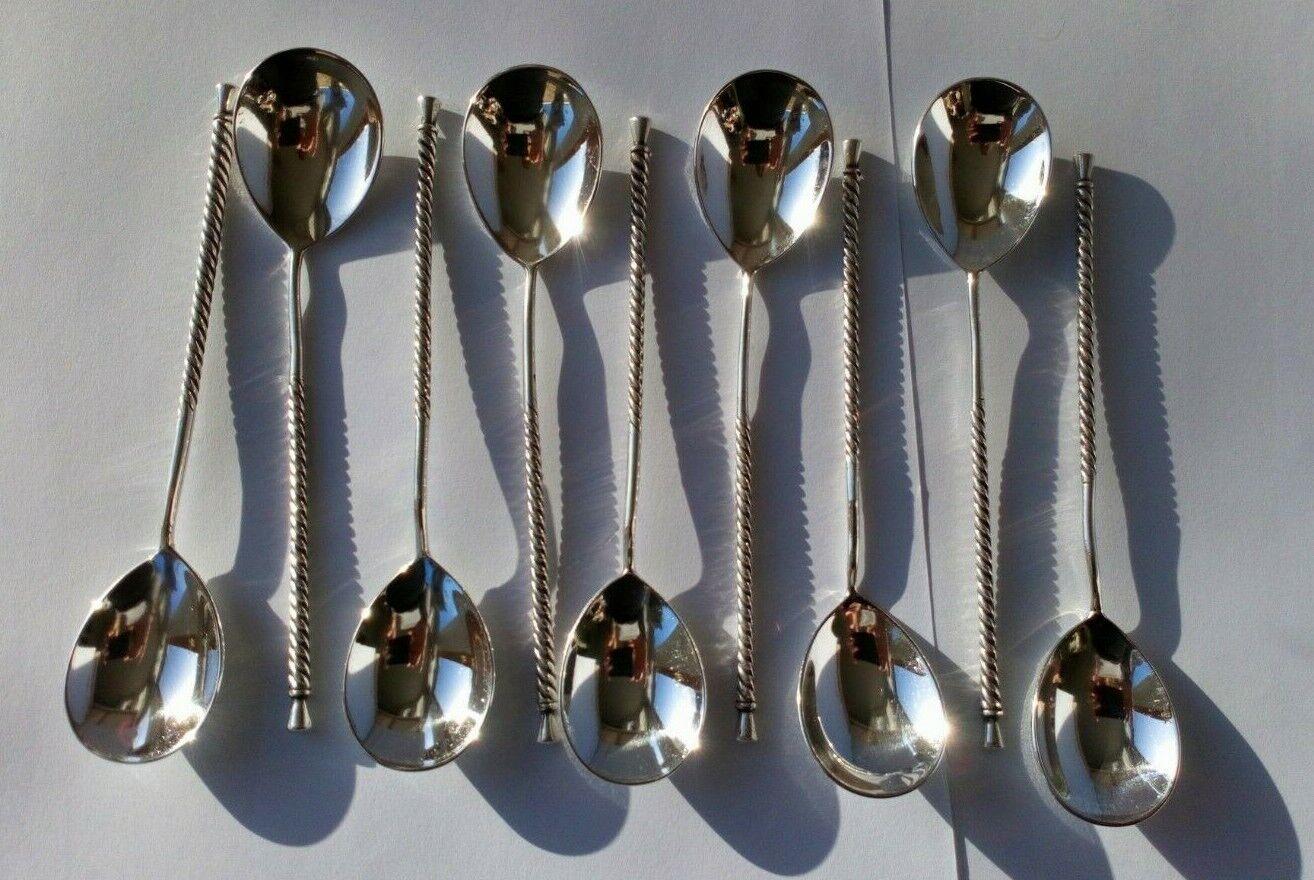 Set of Nine Sterling Silver Twisted Stem Demitasse Coffee Spoons

In very good condition, this is a beautiful set.
Hallmarked: Made by MK2. There are no date marks. 

Additional Information:
Total silver weight: 136.8g for the 9
Size: 13cm long. The