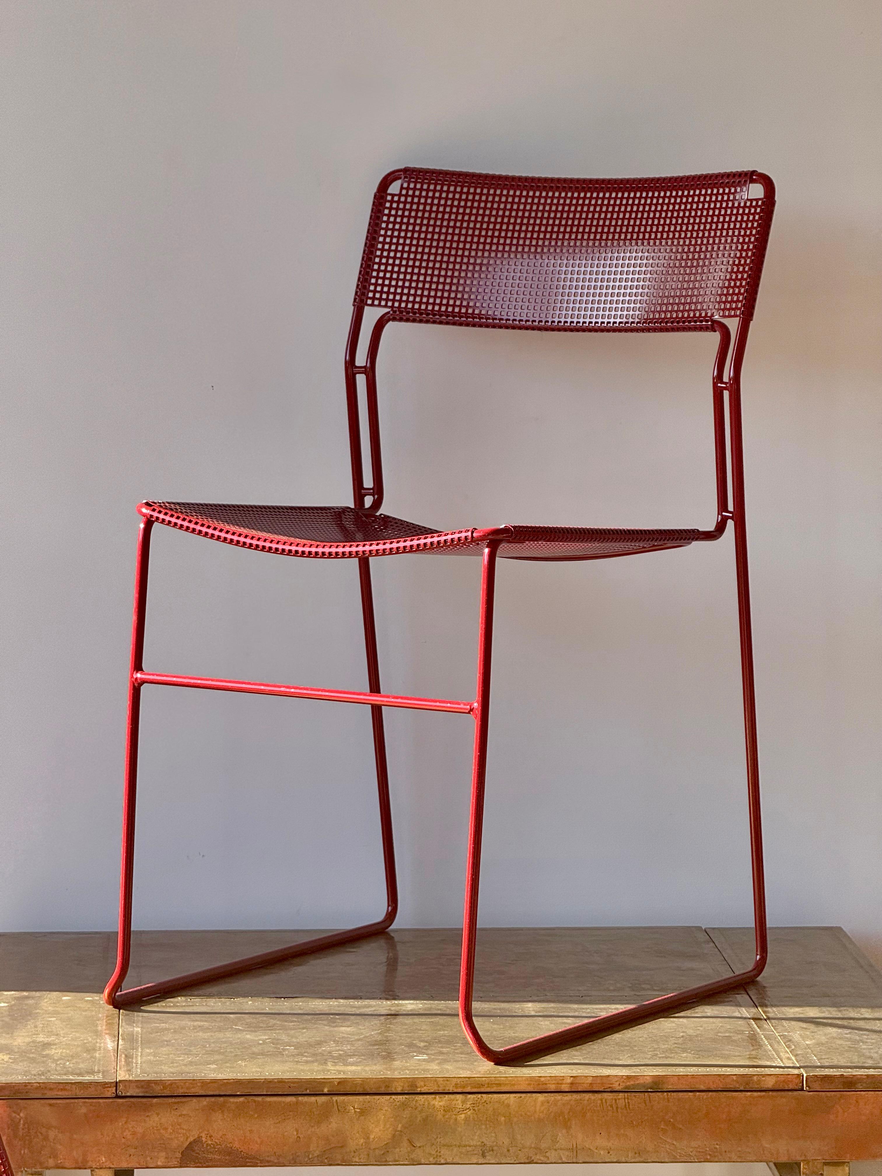 A striking Set of 9 “Sultana” dining chairs manufactured by Arrben, Italy, likely dating from the late 1970s to early 1980s. These chairs showcase a sculptural modern aesthetic, built with tubular steel frames and original perforated steel seat and