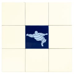 Set of 9 Used Beige - Yellow and Blue Michelin Man Tiles, circa 1960
