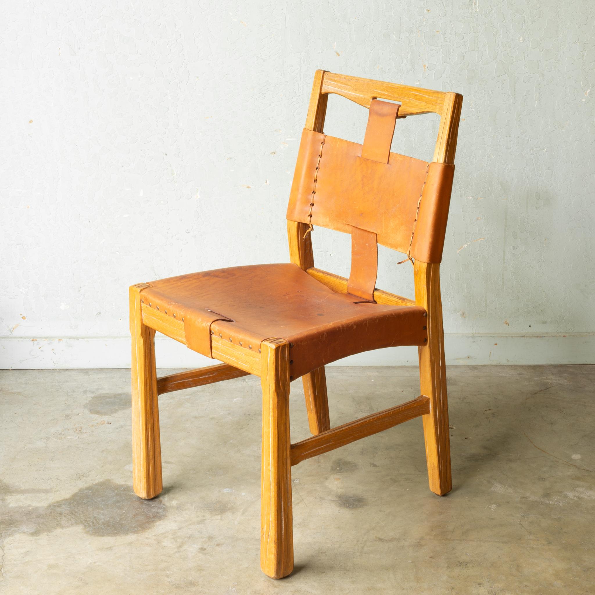 About

Armchair and two side chairs have sold. Two side chairs are available. 

A set of two cerused white oak dining chairs with brass rivets, whip stitching, leather seat and back and one central leather strap running from the back of the