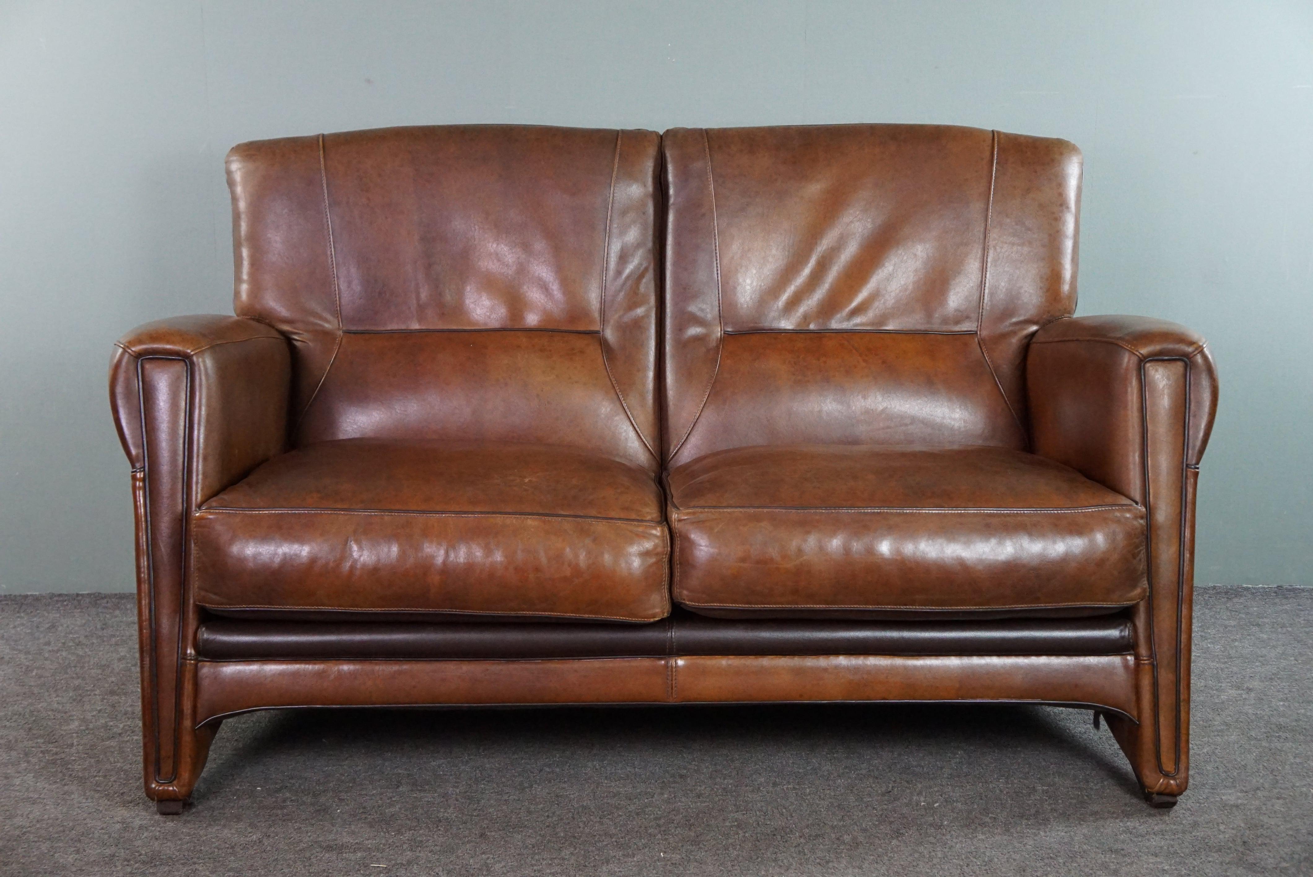 Offered is this beautiful set of a sheep leather design sofa and armchair in good condition.

With the purchase of this set, you will immediately fill your living room or office with something comfortable, beautiful, and unique. Both the sofa and