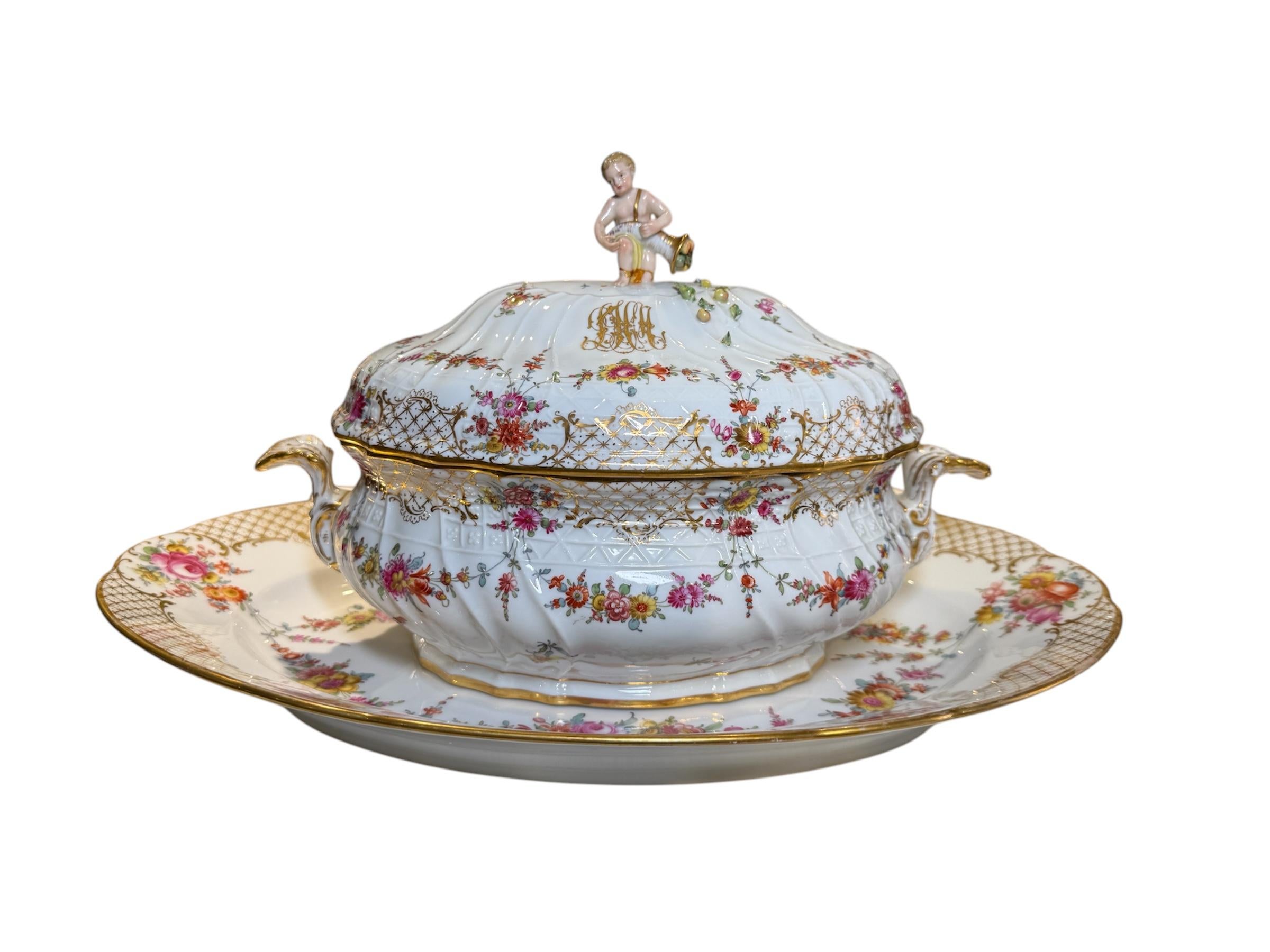 This is a Set Of Ambrosius Lamm of Dresden Porcelain Serverware and Platters. This set consists of 33 pieces. It depicts several platters and serverware that are decorated with a hand painted pattern of a garland of flowers and gilt lattices. Both