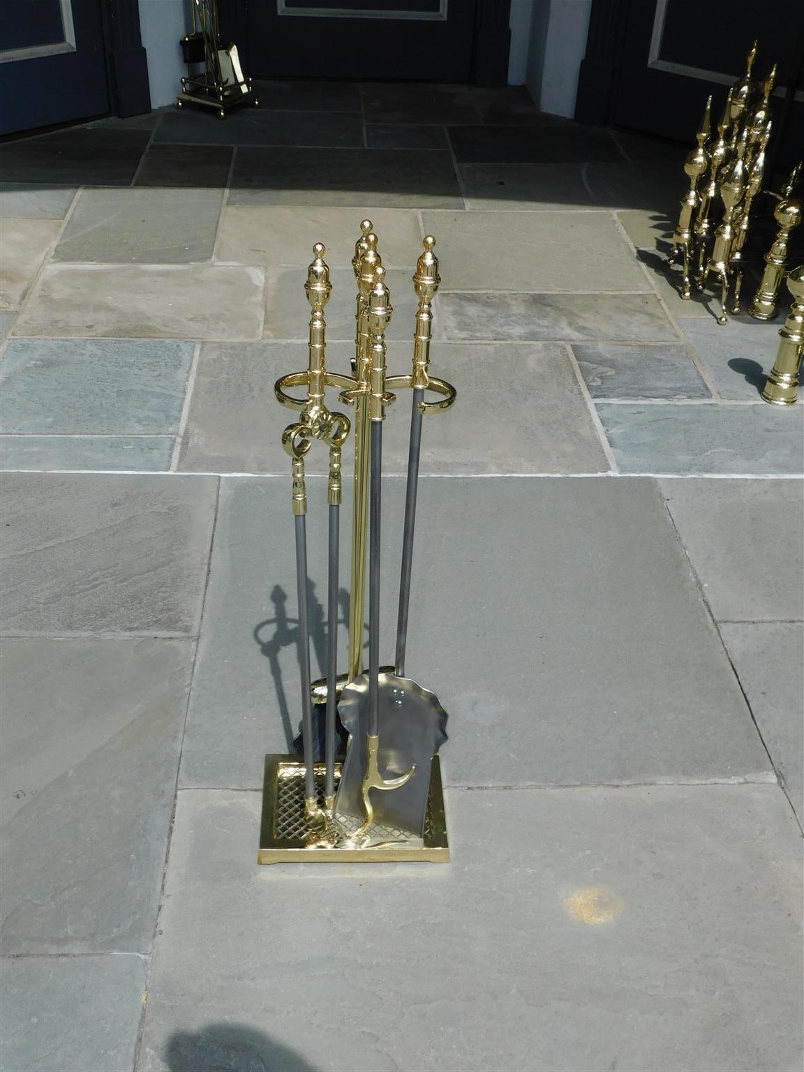 Set of American brass urn ringed finial and polished steel fire place tools on stand. Set consist of tong, poker, shovel, and brush. 19th century.