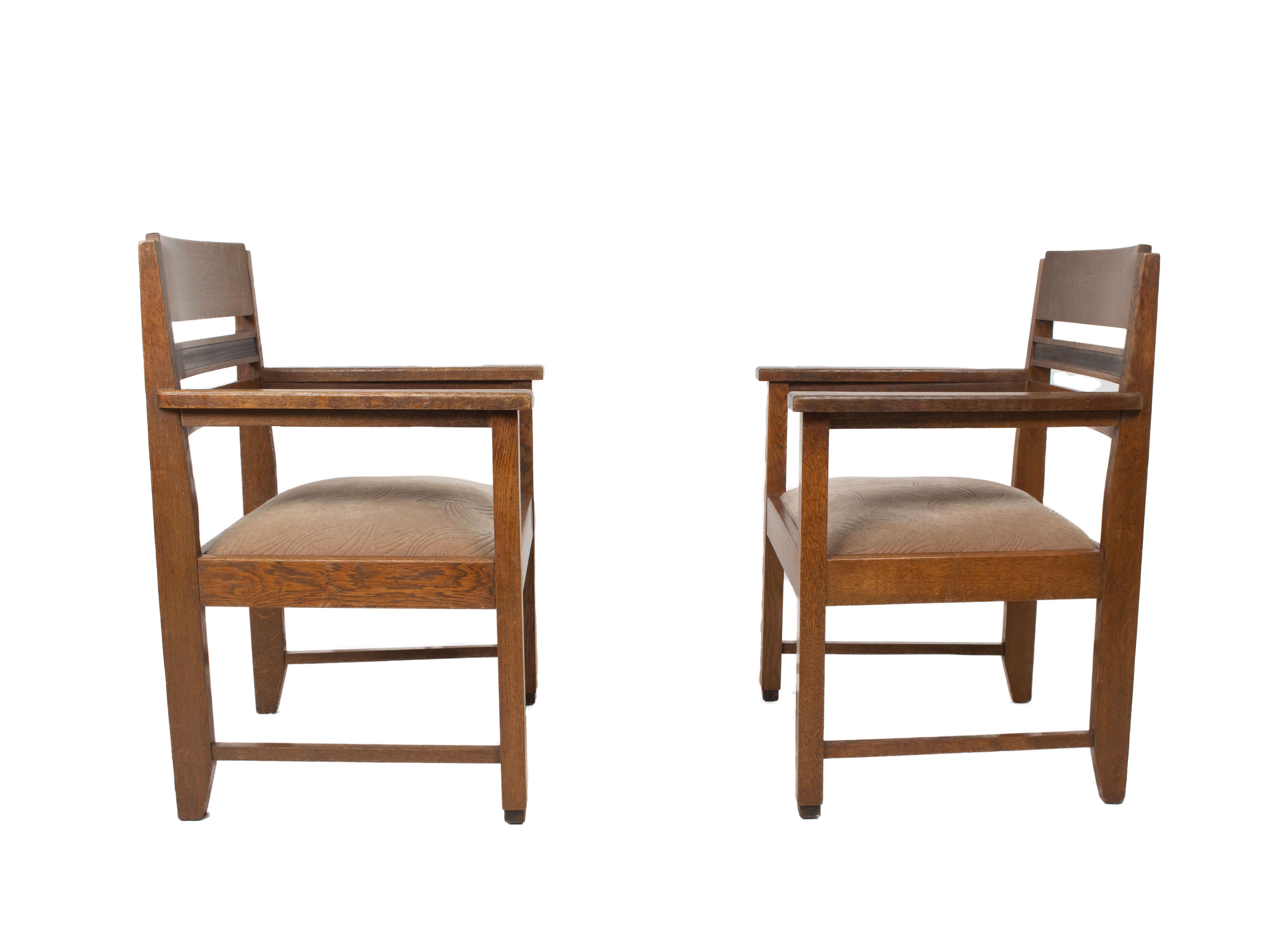 Set of Robust Amsterdam School arm chairs from the Netherlands ~1930s. These armchairs have the well-known Amsterdam School combination of coromandel and oak wood. The seating is with beige fabric. The chairs are in good condition with normal wear