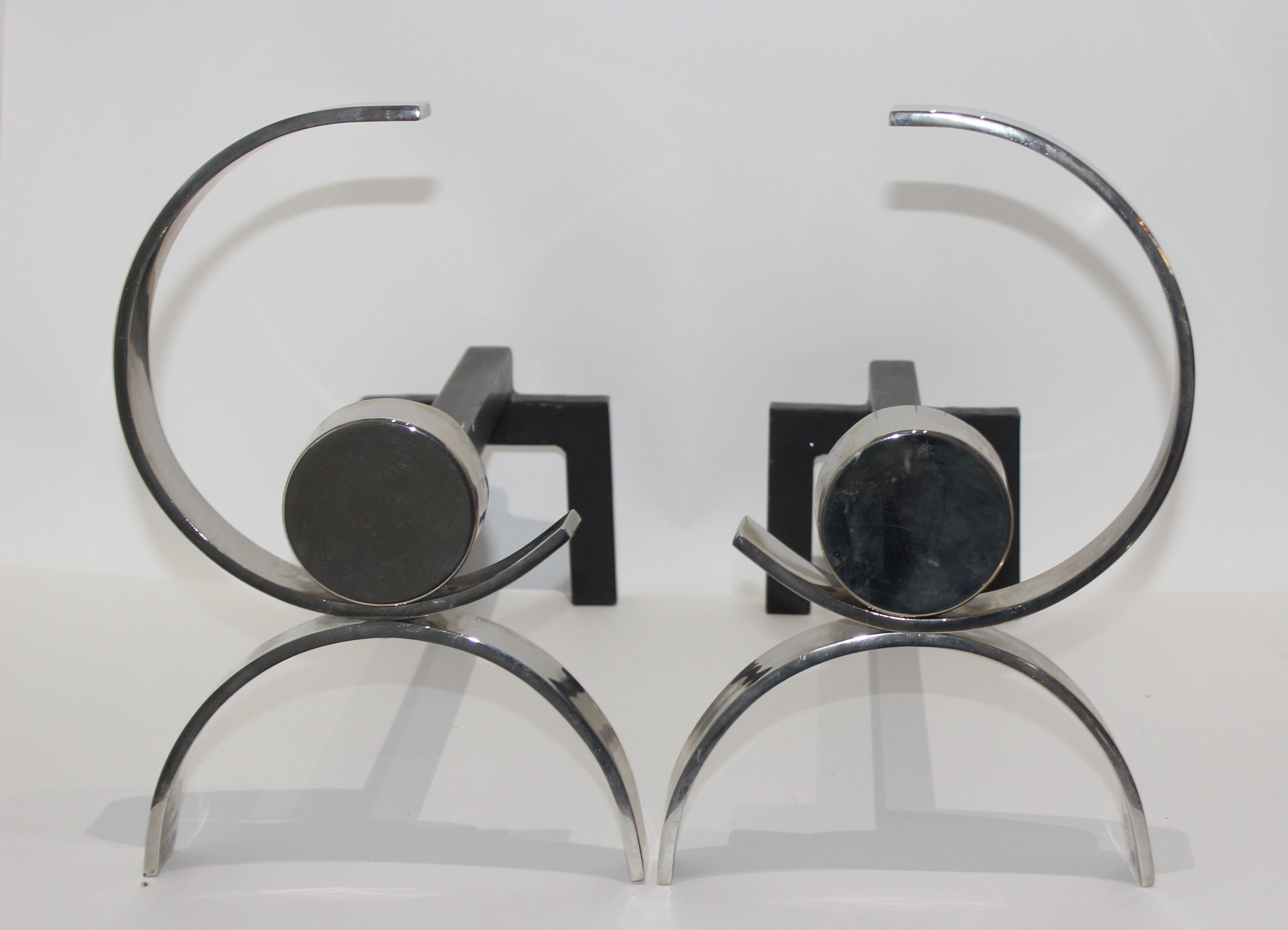This stylish moderne set of andirons date to the late 1930s-early 1940s and were created by the iconic American designer Donald Deskey and they were acquired from a Miami Beach estate.
