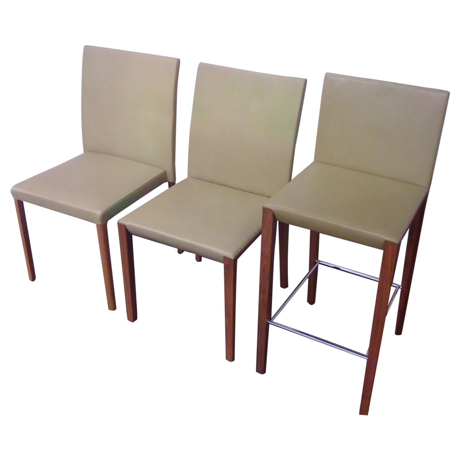 Set of Andoo Chairs and Counter Stools in Leather with Walnut Legs