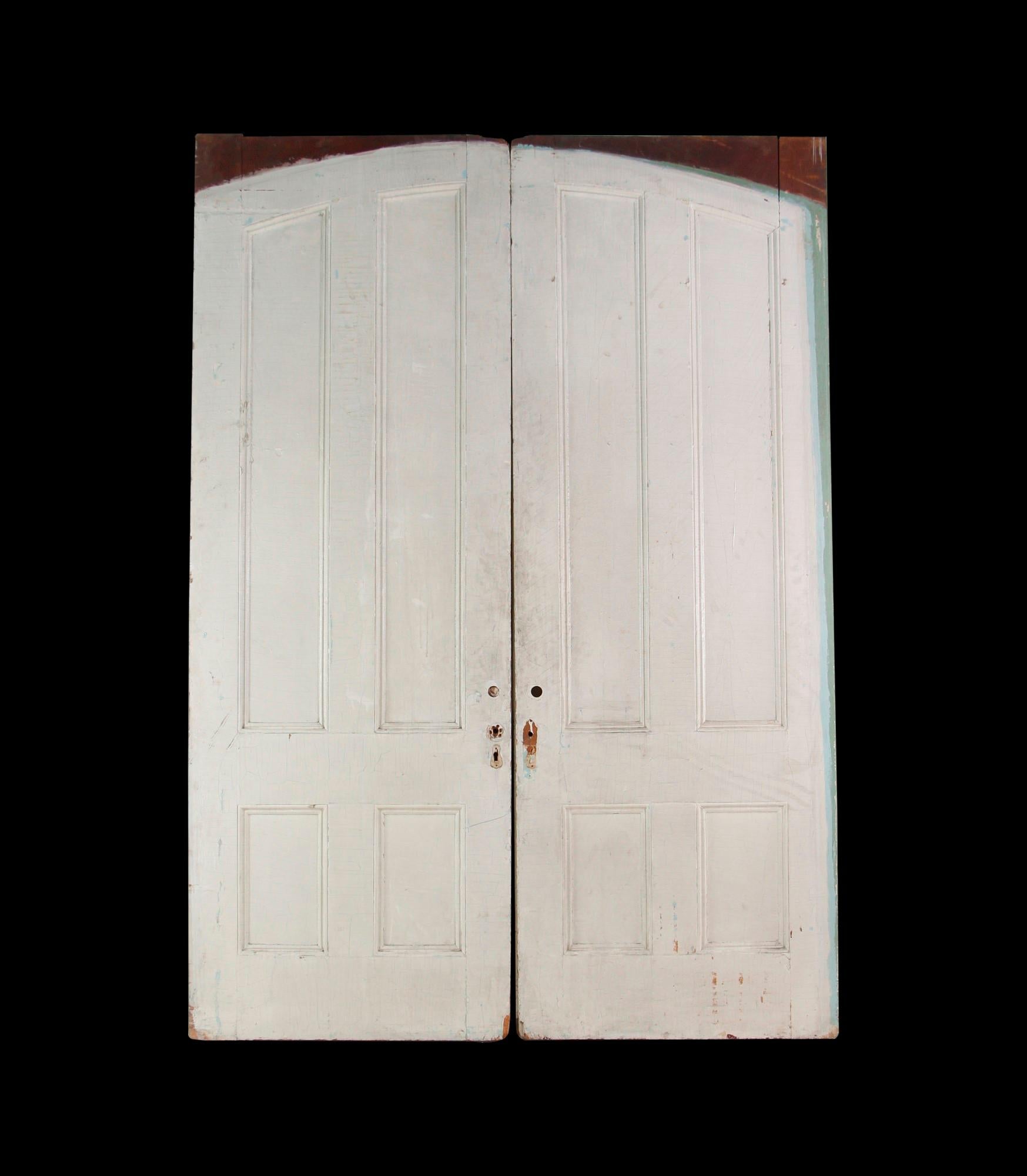 These early 1900's wood pocket doors have four vertical panes and are painted white. They are priced as a double. This set can be seen at our 400 Gilligan St location in Scranton, PA. Measures: 103 x 72.5.