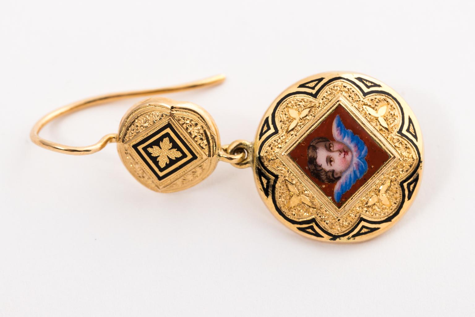 Circa late 1800's 18K Gold and Enamel painted Brooch and Earring set in original box. Made in Switzerland. The earrings measure 1.50 Inches long with a weight of 4.90 Grams. The brooch weighs 5.50 Grams and measures 1.50 Inches wide by 1.50 Inches