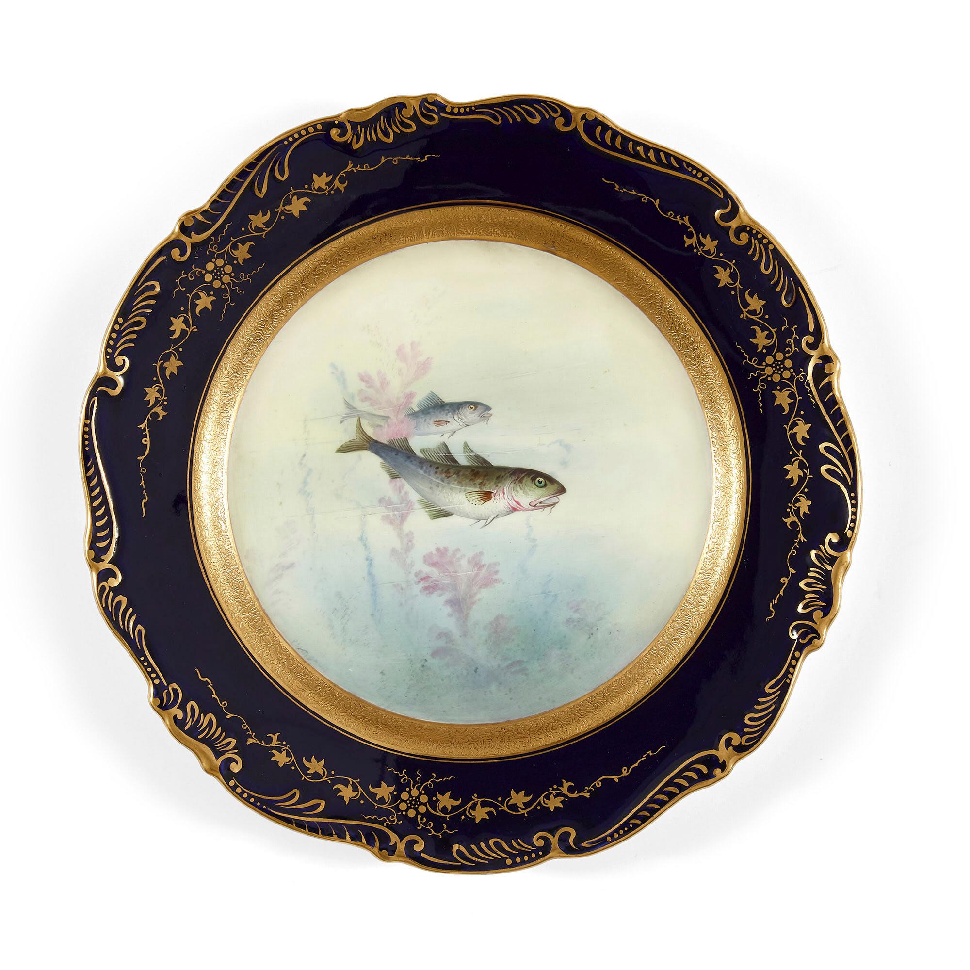 Set of antique coalport porcelain dinner plates depicting English fish.
English, late 19th century
Dimensions: Height 2cm, diameter 22cm

This charming set of nine dinner plates are of circular form, each decorated with a painted blue and gilt