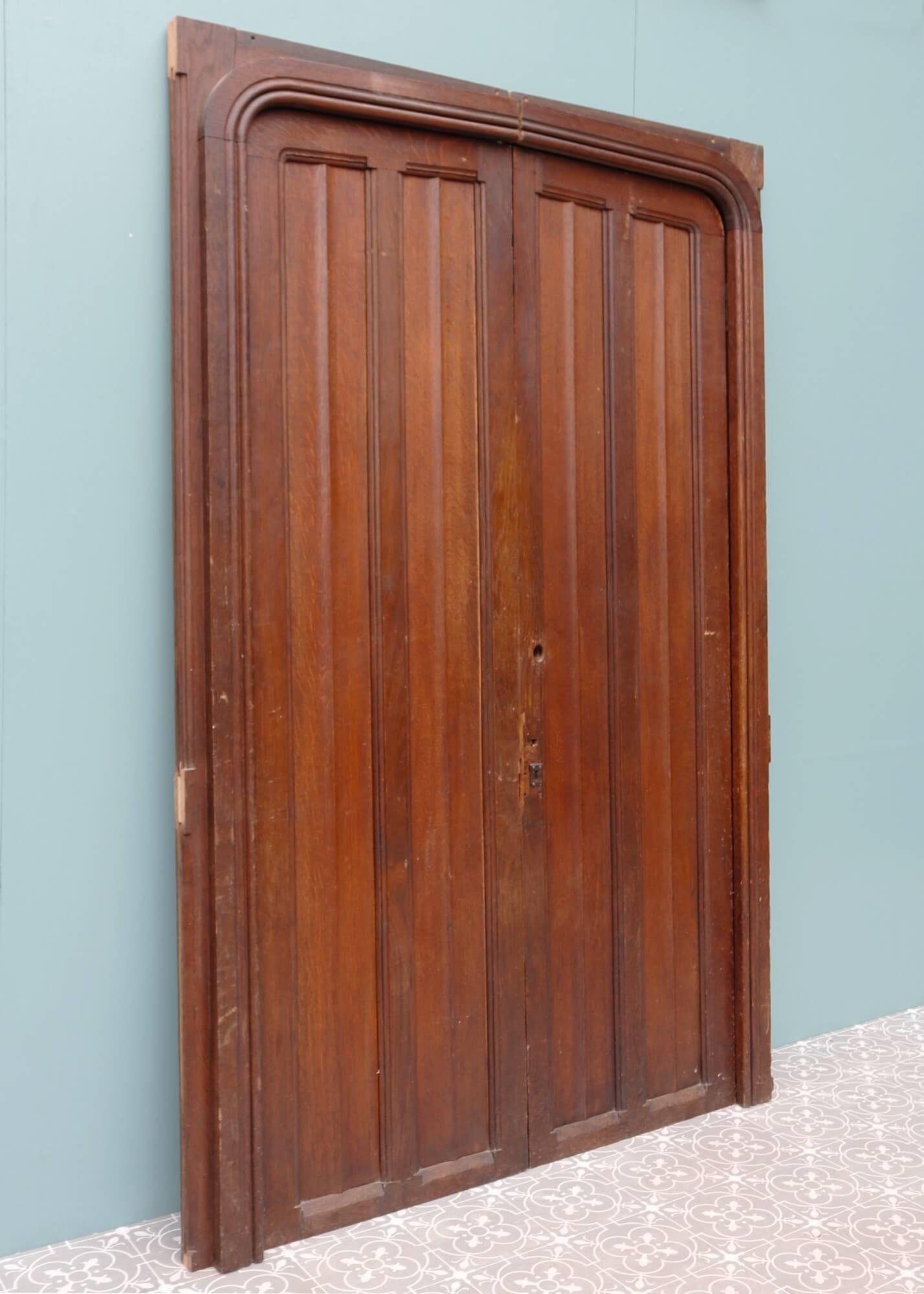 These Edwardian oak doors with frame are originally from Rochester Cathedral, the second oldest Cathedral in England. We are also selling a single internal door salvaged from the same location. These double doors create a shallow arch, each detailed