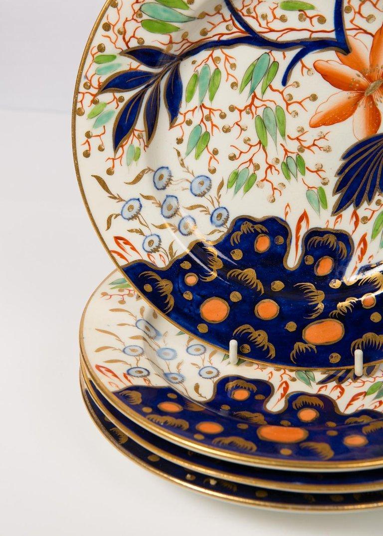 A set of a dozen dishes with an Imari pattern which reinterprets Chinese export porcelains from an English viewpoint. The choice of colors in this Coalport pattern is unexpected. The combination of one bright orange flower among turquoise and pale