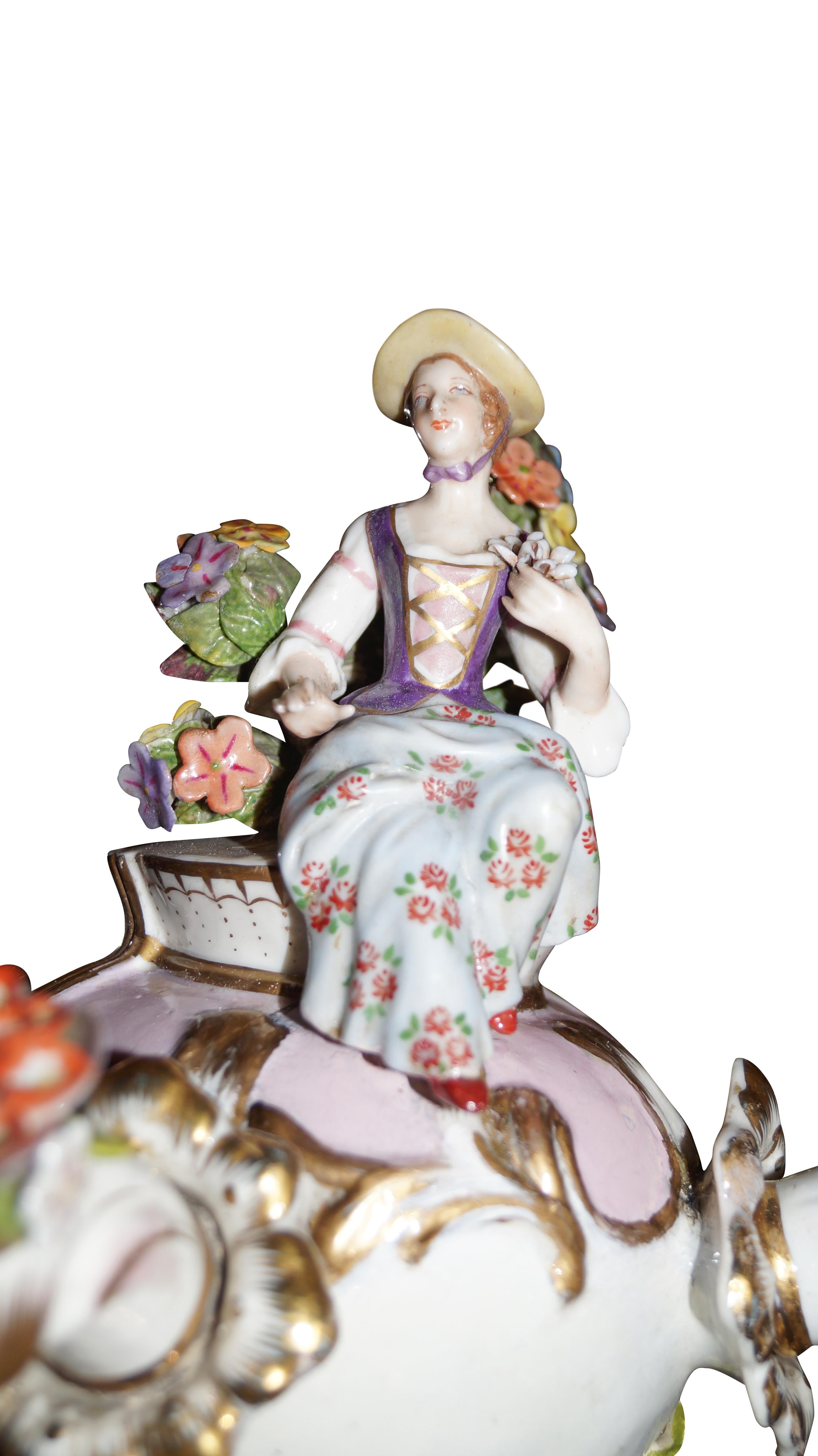 Beautiful and good keeped set of antique Meissen Porcelain applique, early 1900s.

The set is with two figurines, porcelain lady figurine and a porcelain man figurine and the two porcelain pendants are built with different beautiful and colorful