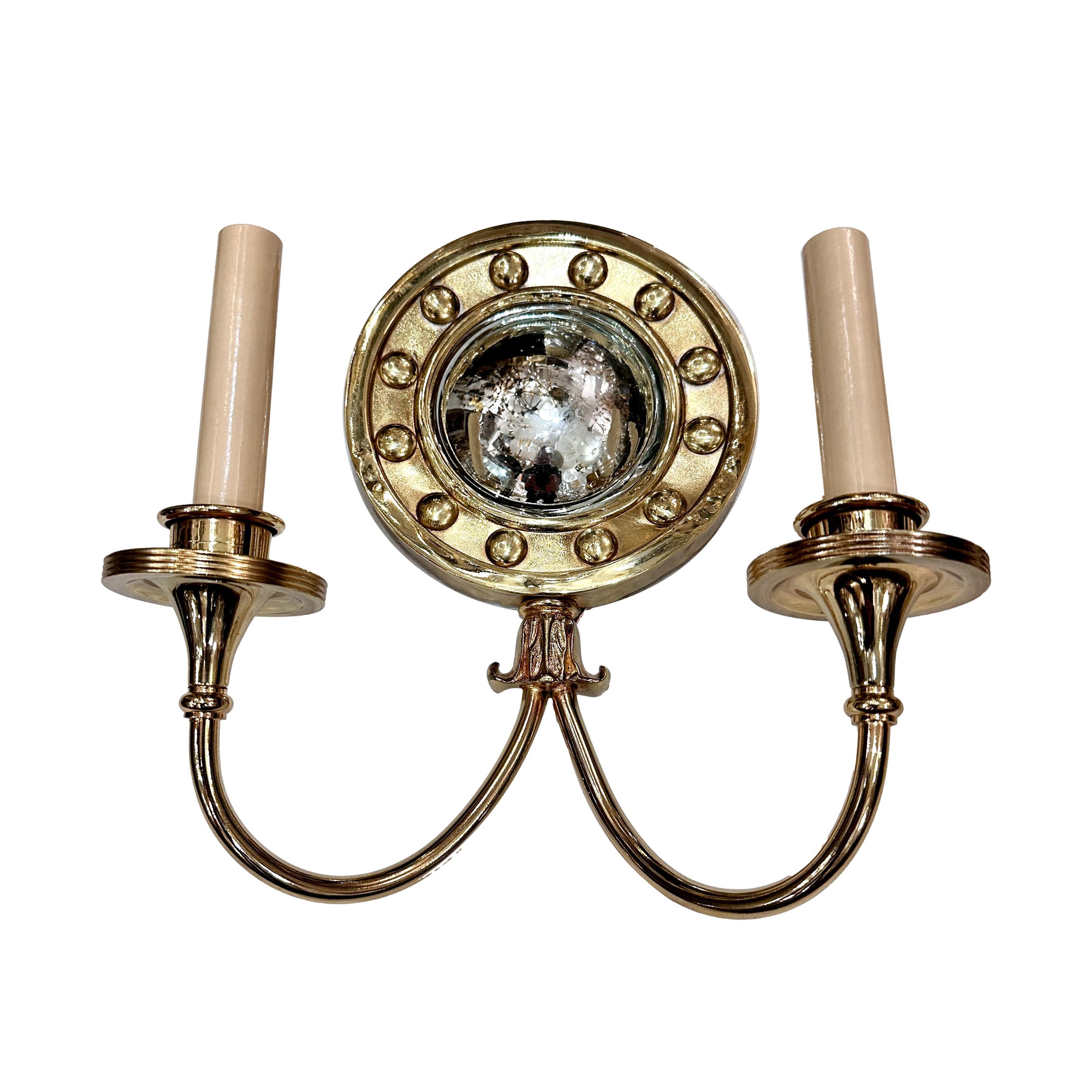 A set of of ten English circa 1960's polished brass sconces with mirror insets. Sold per pair.

Measurements:
Height: 12