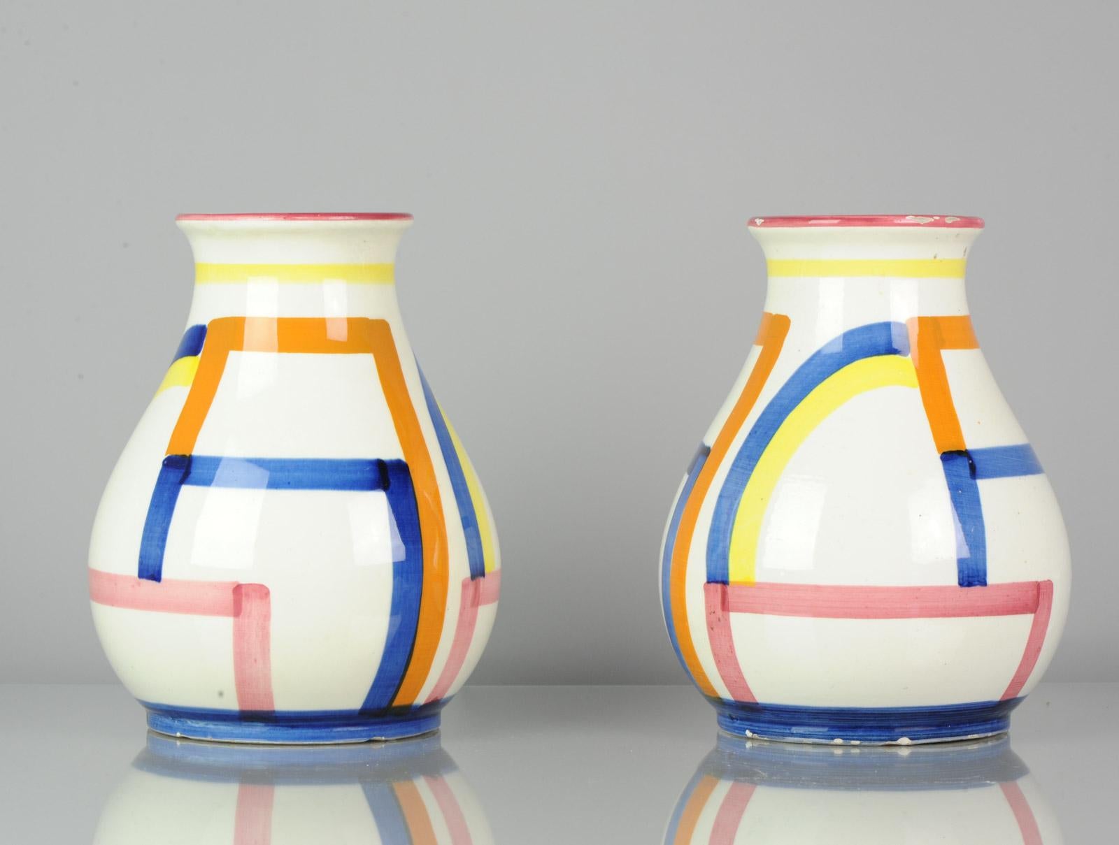 A lovely set of 2 vases, Germany 1920s Art Deco.

Some rimfritting and 1 small restored chip to rim. 180mm.
 