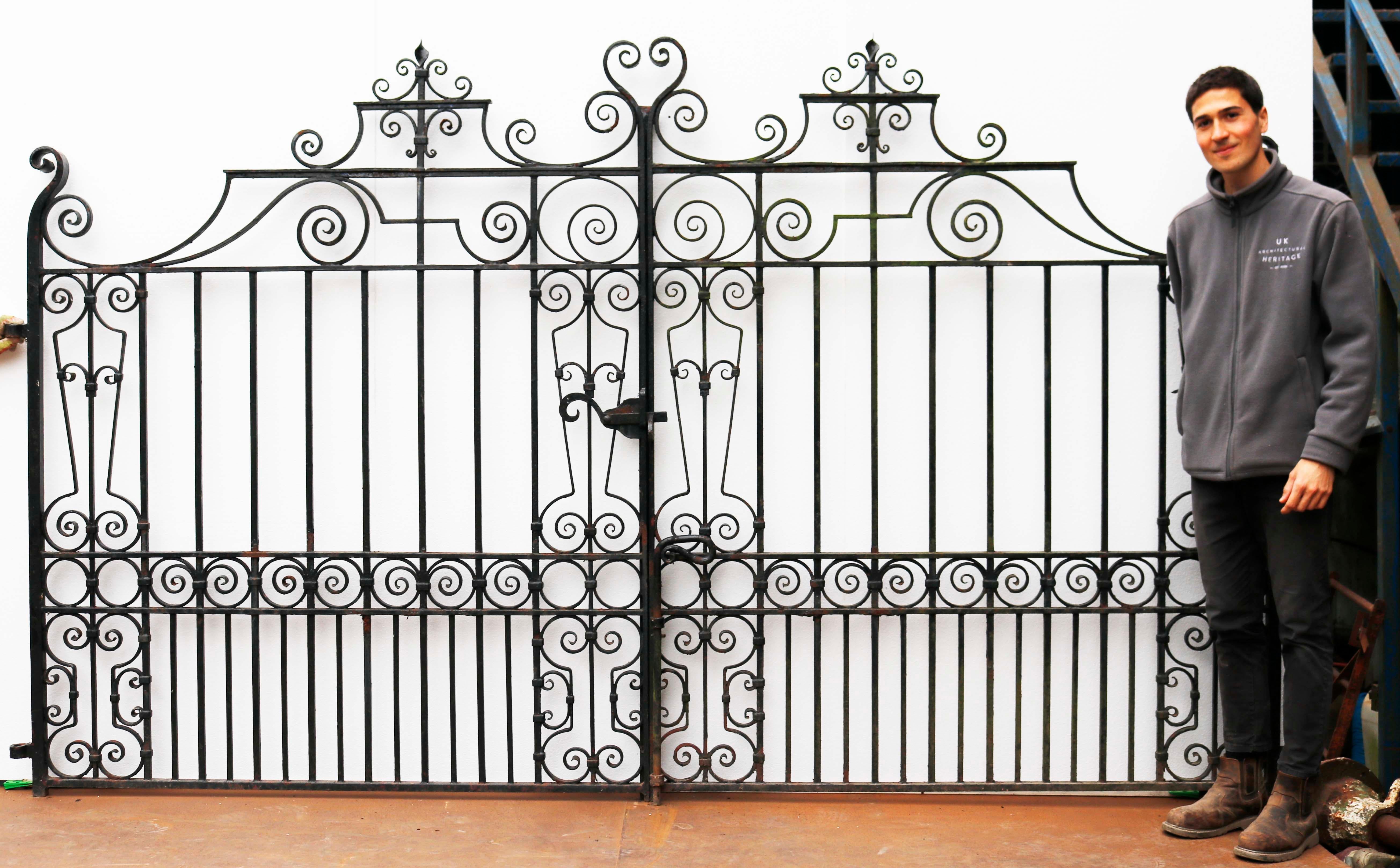 Set of Reclaimed Wrought Iron Driveway Gates. Blacksmith made gates with a scroll design. These came from a house in Tonbridge, England.

There are two matching sets of these gates available.

Measures: Height to centre 193 cm

Height to