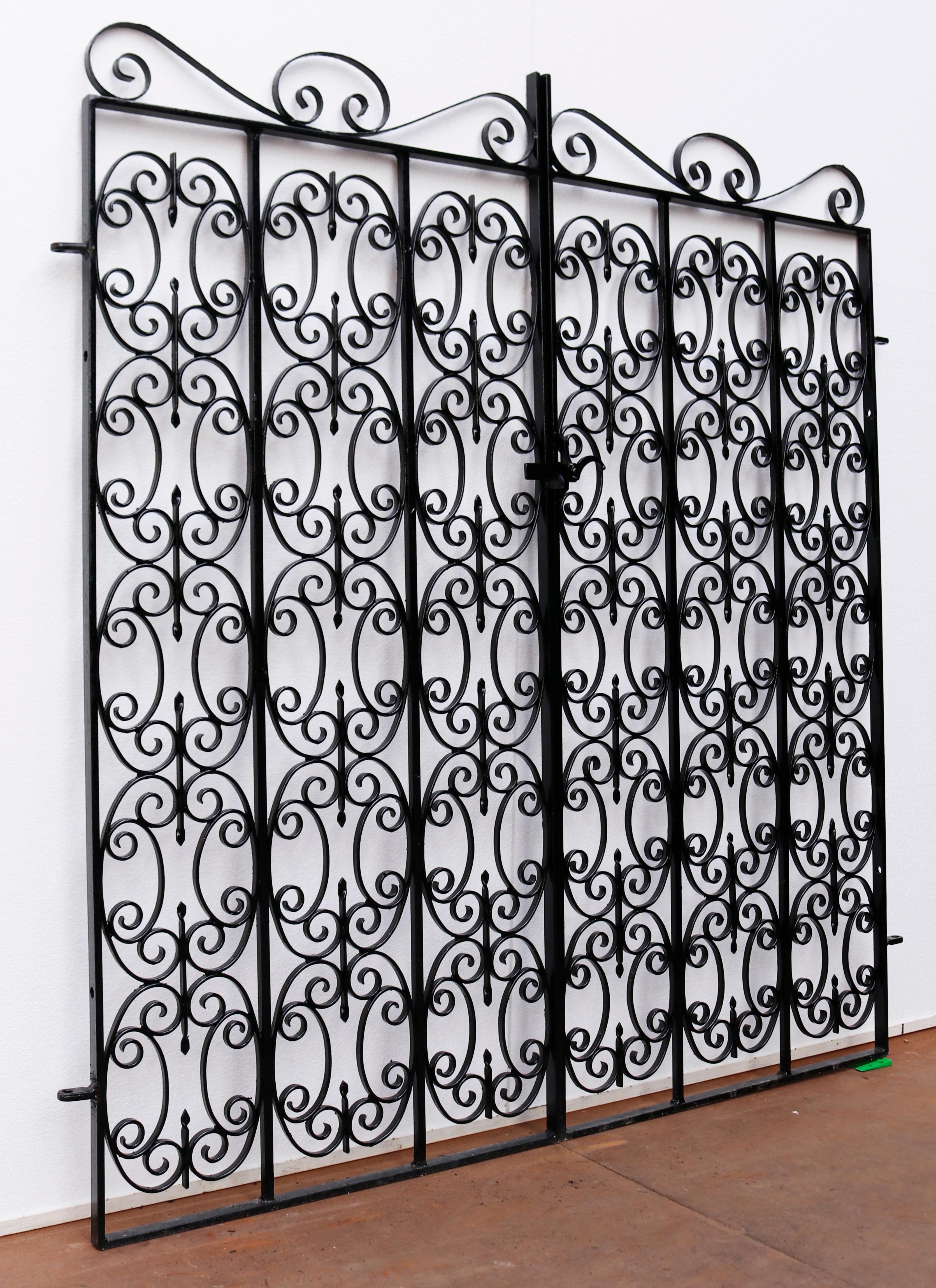 Pair of reclaimed wrought iron garden gates. A set of wrought iron garden gates with a repeated scrollwork design.

Additional dimensions 

For an opening of approximately 161 cm.