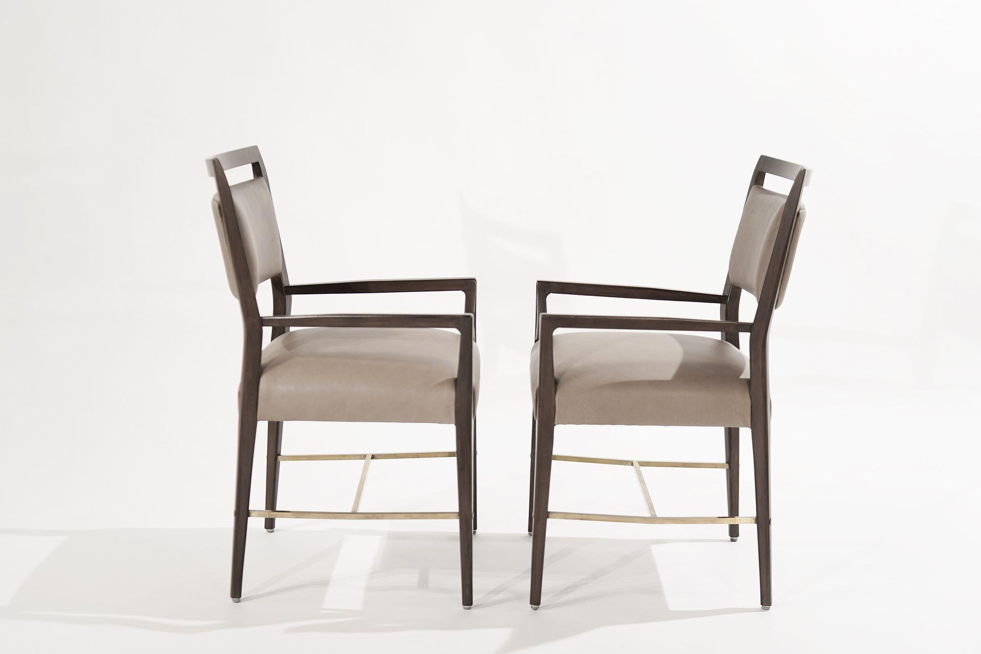 Pair of armchairs designed by the iconic Paul McCoob for his Connoisseur Collection, circa 1950-1959. Completely restored mahogany framework, reupholstered in taupe leather, brass stretchers hand-polished.
 
Other designers from this period