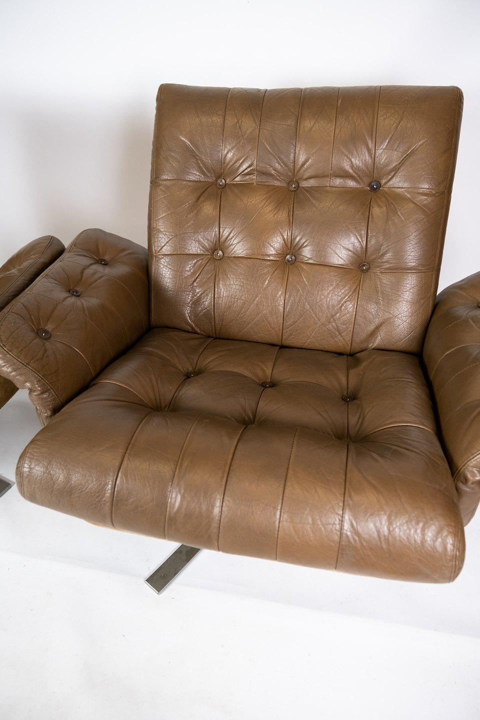 Set of armchairs upholstered with brown leather and frame in metal of Danish design from the 1970s. The chairs are in great vintage condition.
  