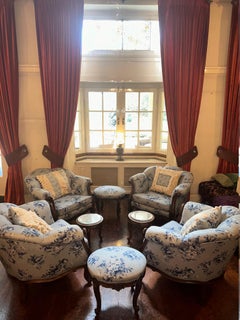 set of armchairs with small tables