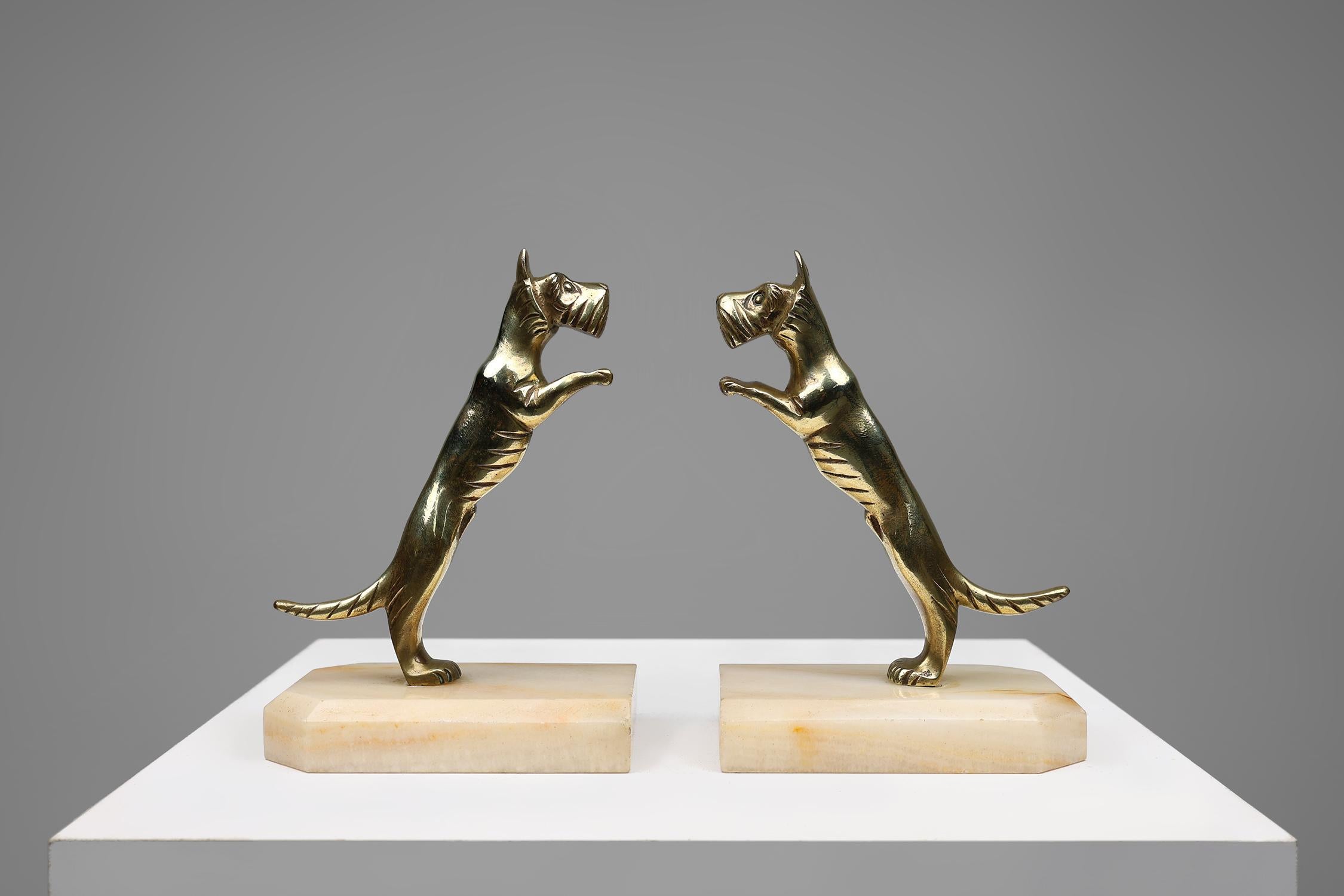 France / 1930 / 2 bookends / copper, marble / Art Deco / Mid-century

A beautiful detailed set of bookends, featuring two copper terrier dogs each on a marble base. Crafted in France in the 1930s. 

These statues exude a timeless charm that