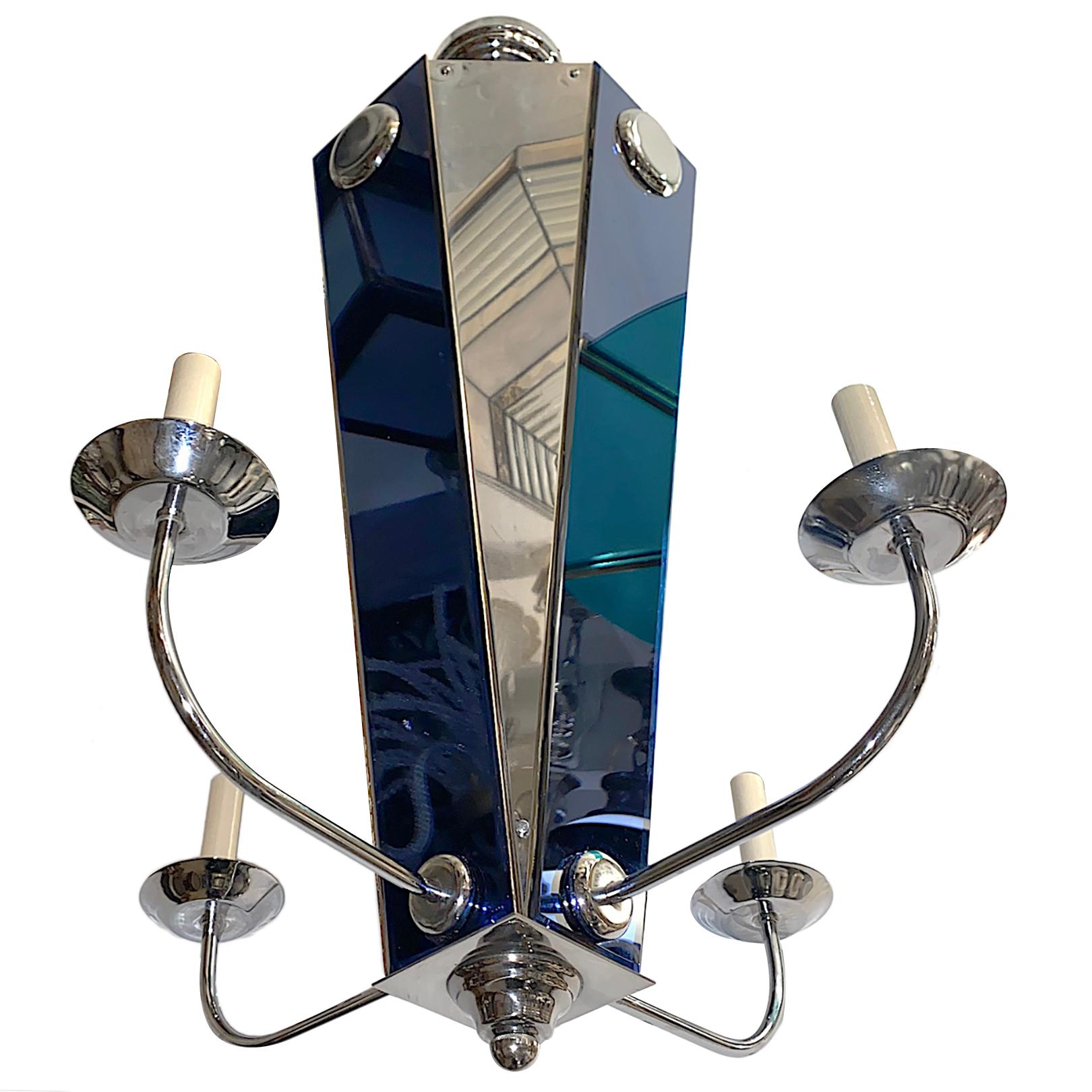 A set of nine circa 1950s French Art Deco style chandeliers with cobalt mirror insets. Sold individually.

Measurements:
Height 36
