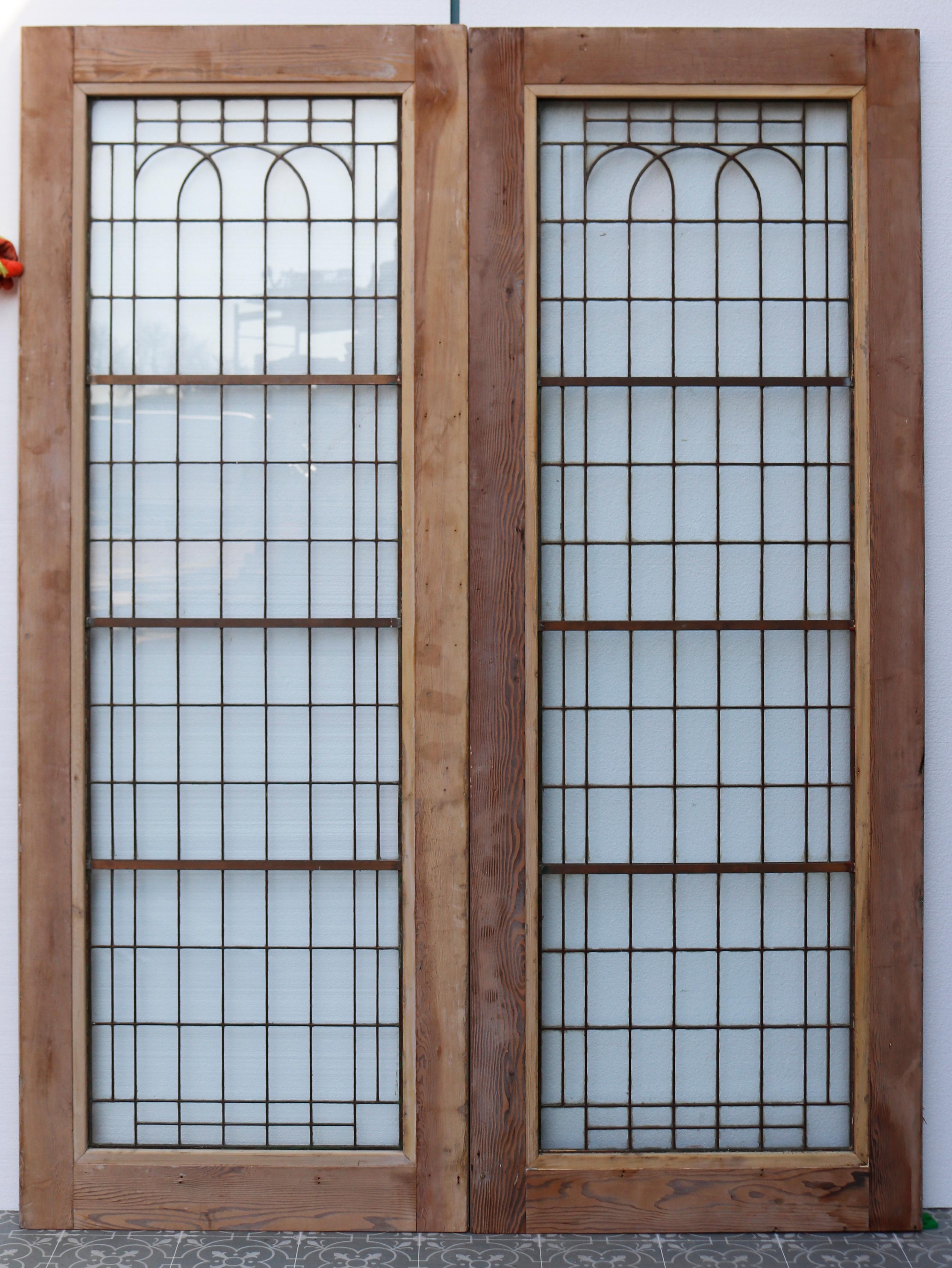 Set of reclaimed Art Deco copper-light double doors with full length glazing.

We have several similar sets available.