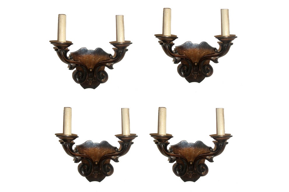 A set of 4 French 1930s copper Art Deco sconces with double light, scrolling motif on arms. Sold in Pairs.

Measurements:
Height: 11