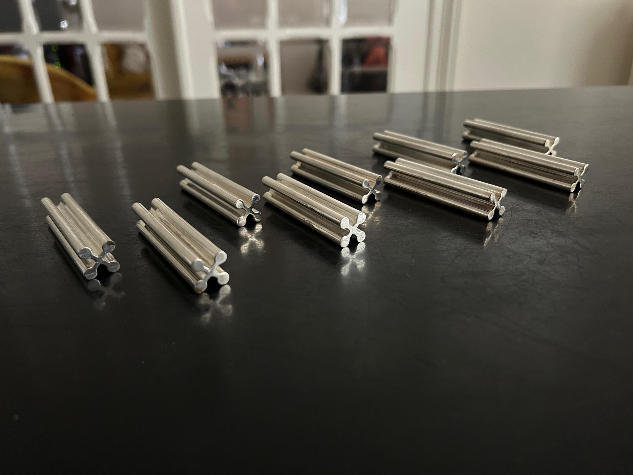 set of 9 silver plated knife holders from the art deco period 
all stamped MSL 
