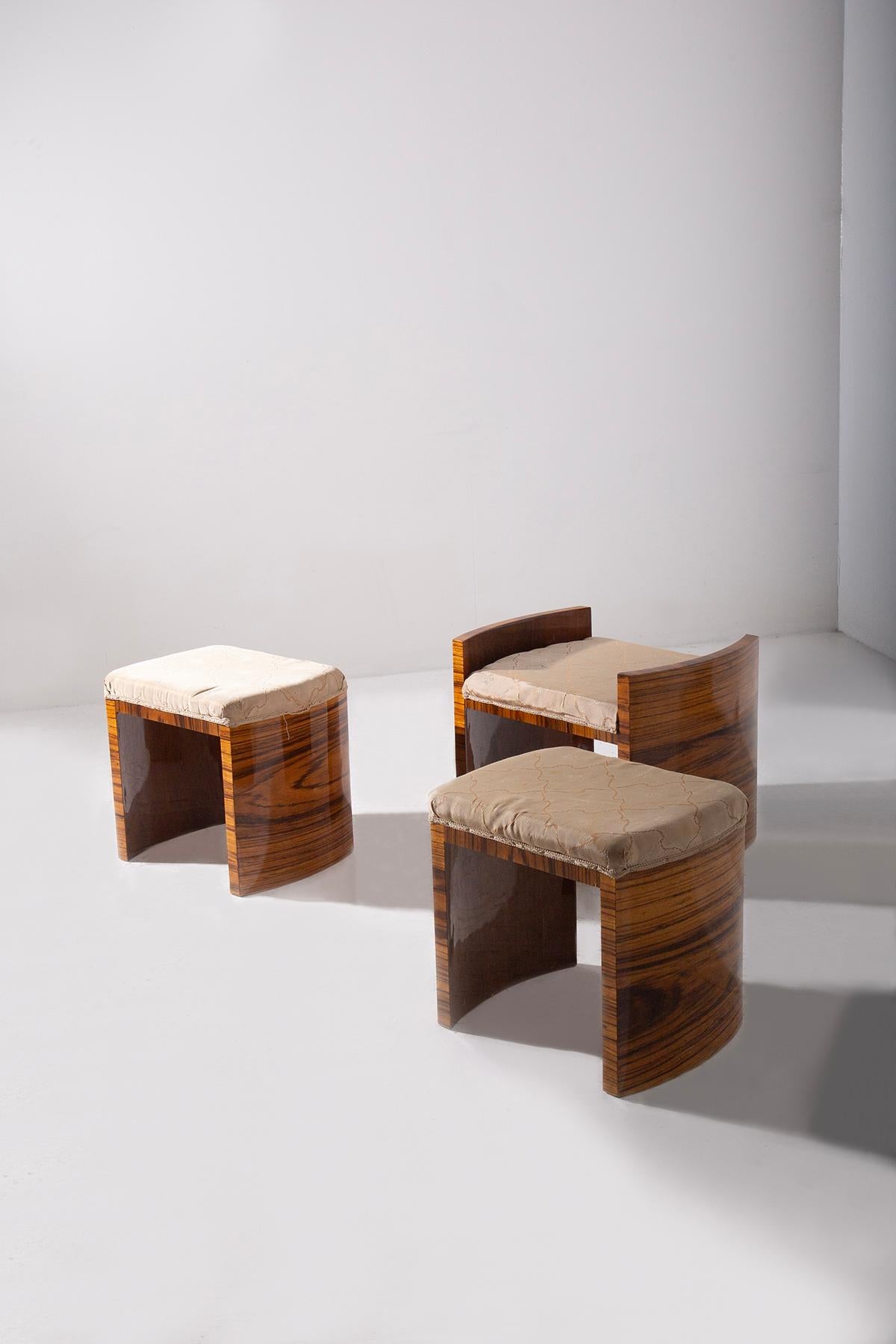 Explore the elegance and timeless charm of this set of three Art Deco style stools. Masterfully crafted from briar wood, each piece showcases the refined beauty and intricate patterns that are hallmarks of the Art Deco movement. These stools,