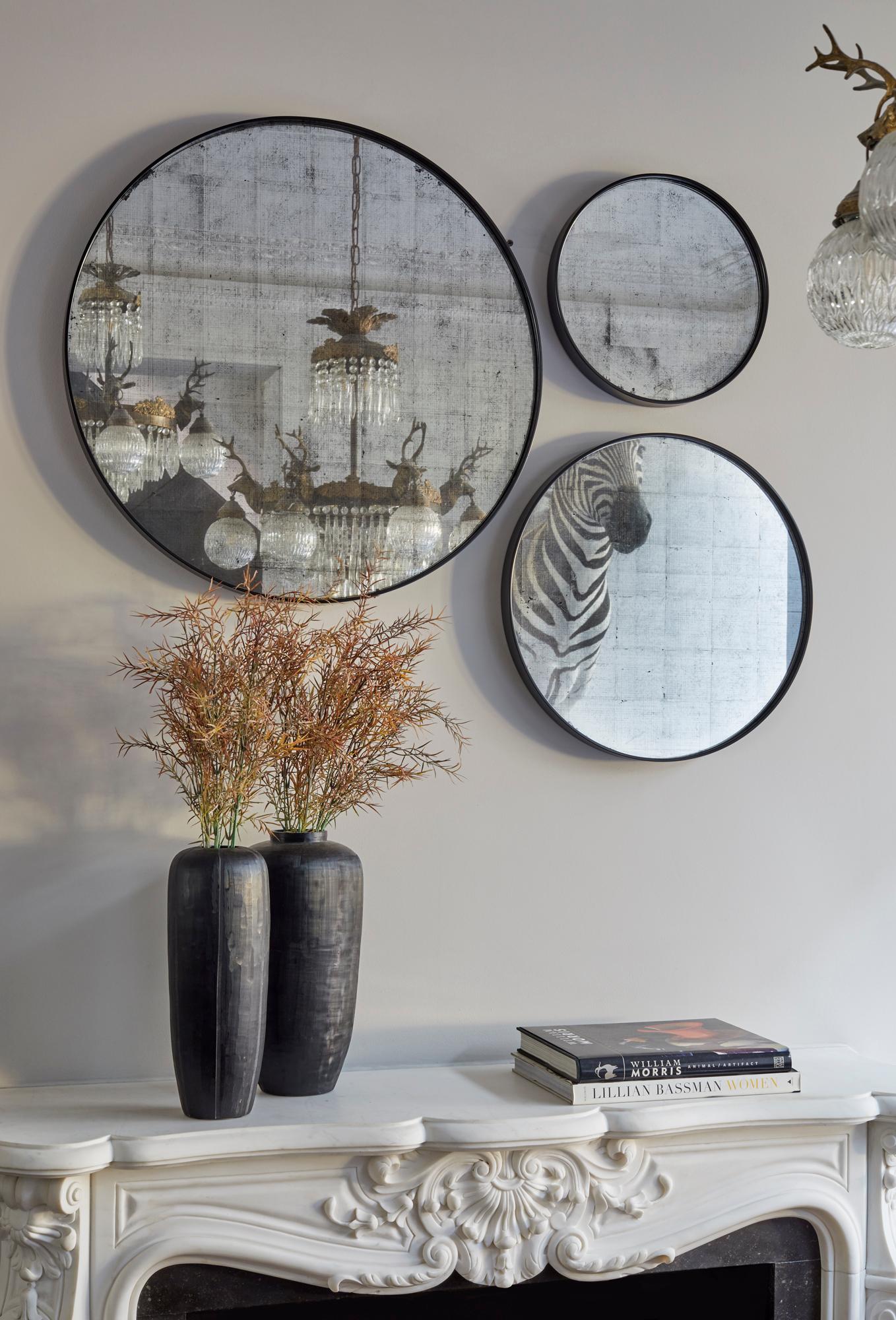 We adore the concept of multiples, and the Eros Collection's trio of Verre Èglomise mirrors are a chic, effortless statement. Eros, the Greek god of sexual appeal and Cupid's Roman counterpart, inspired this series of white mirrors, which will
