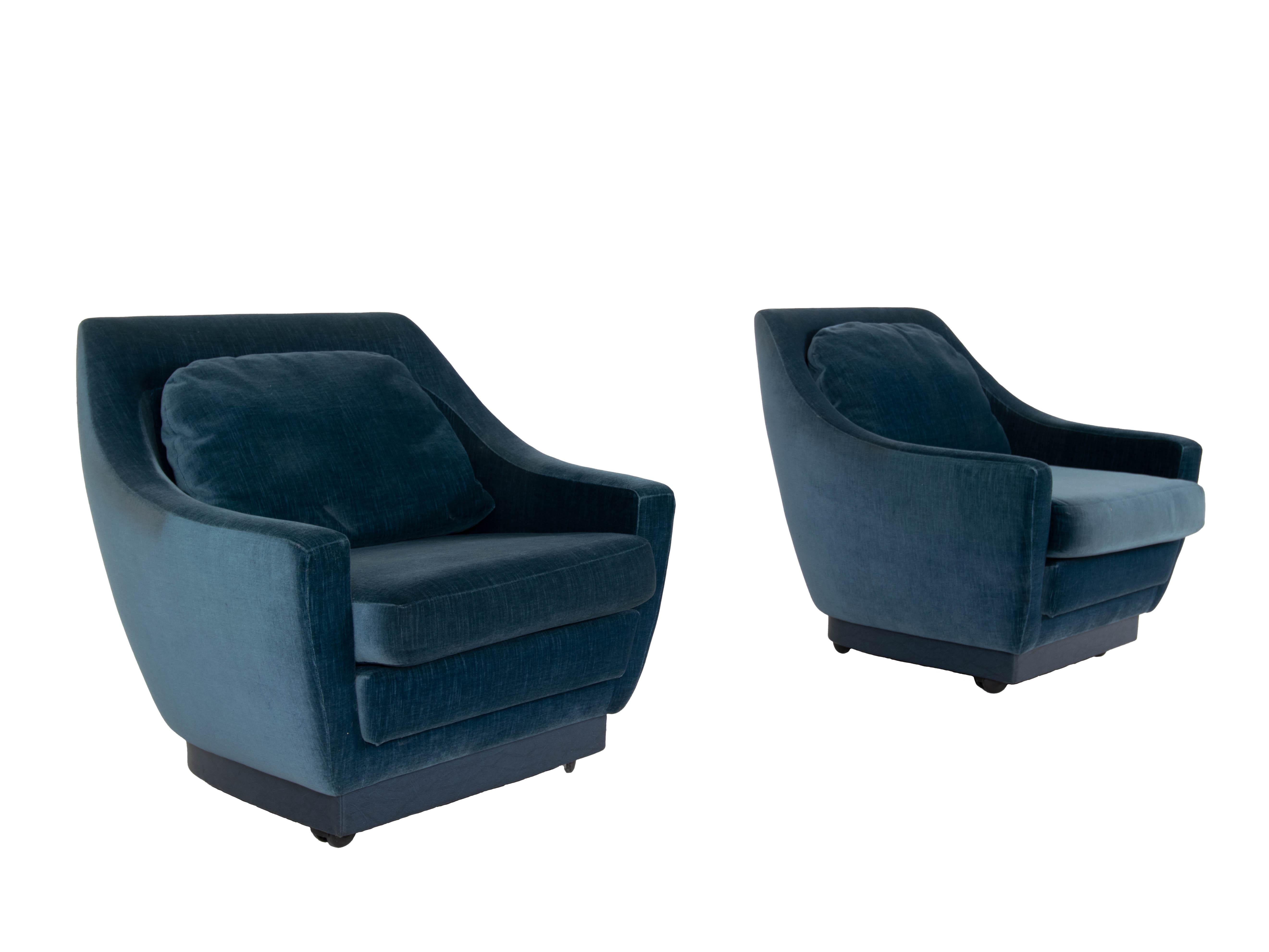 An impressive set of Art Deco style two lounge chairs. This set is very professionally upholstered in 1988 by 'Bröring Interieur B.V'. in Amsterdam. It has blue velvet fabric with an edge on the bottom in blue leather. The chairs are very