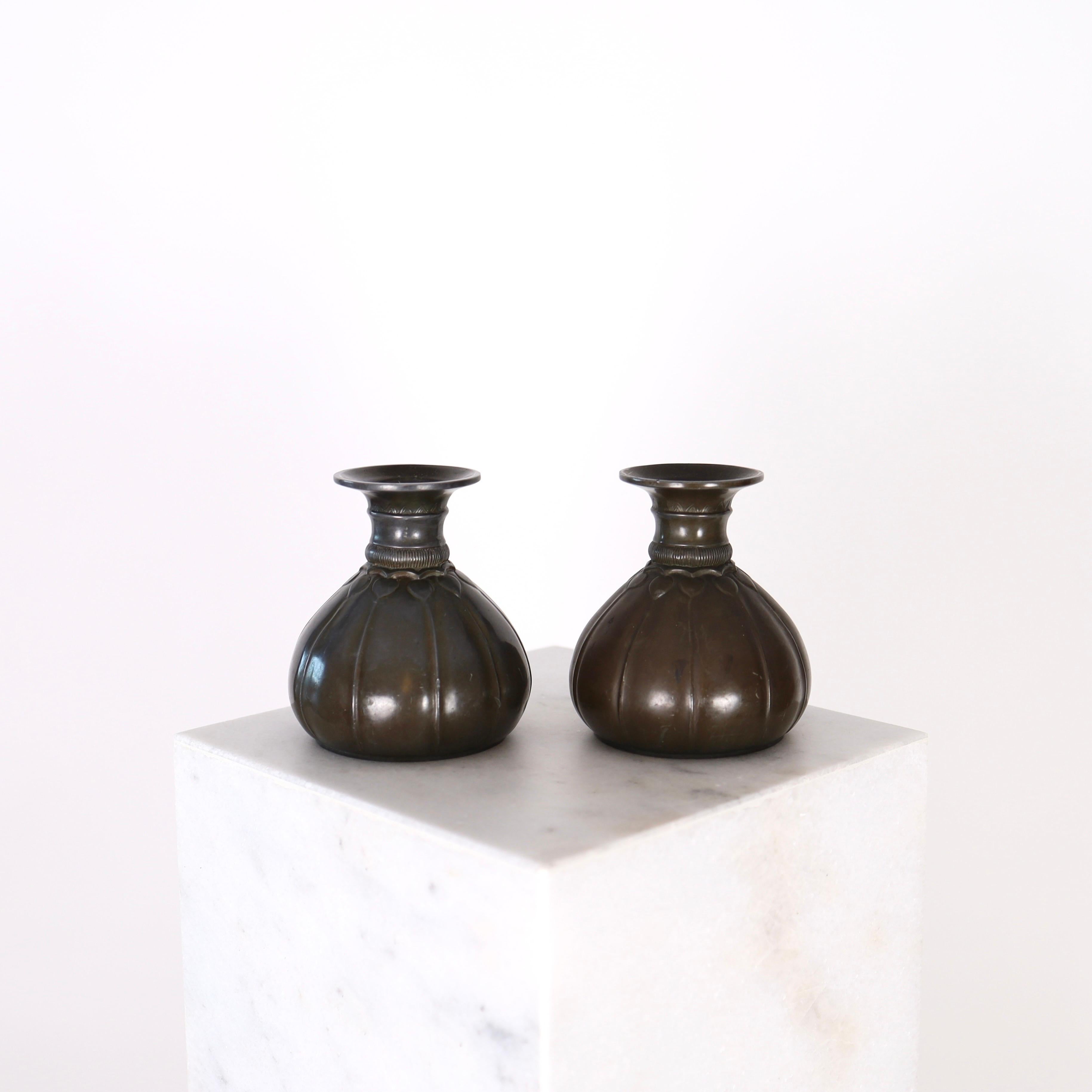 A rare set of metal vases designed by Just Andersen in 1920s. The set is early-work by Just Andersen and a true testament to the Danish design heritage.
 
* A pair of metal vases 
* Designer: Just Andersen
* Style: D88 (stamped 'Just D88')
* Year: