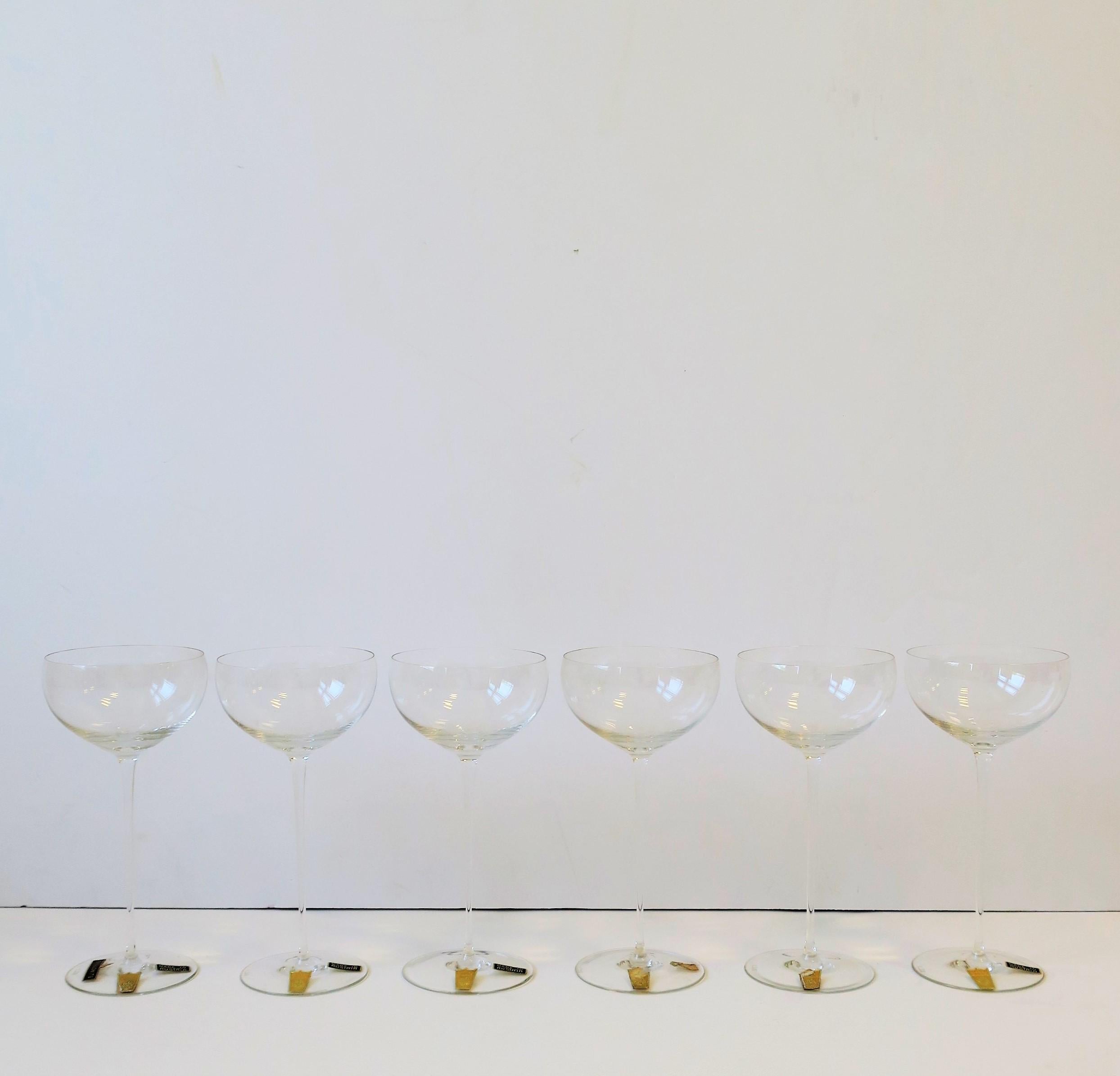 A very beautiful and rare set of 6 Austrian fine crystal Champagne or wine glasses by Claus Josef Riedel, circa early 20th century, Austria. Set appears to have never been used retaining original maker's mark labels (see image #3 and 4.) Designer's