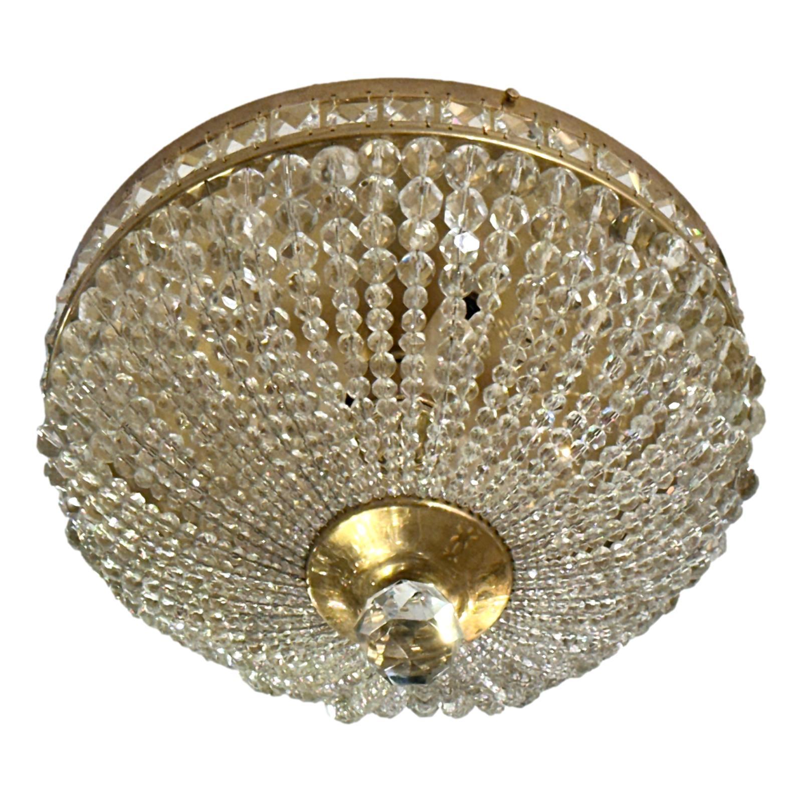 Set of 1950's French gilt metal light fixtures with crystal beads and interior lights. Sold Individually

Measurements:
Diameter:13″
Height: 8.25″ 