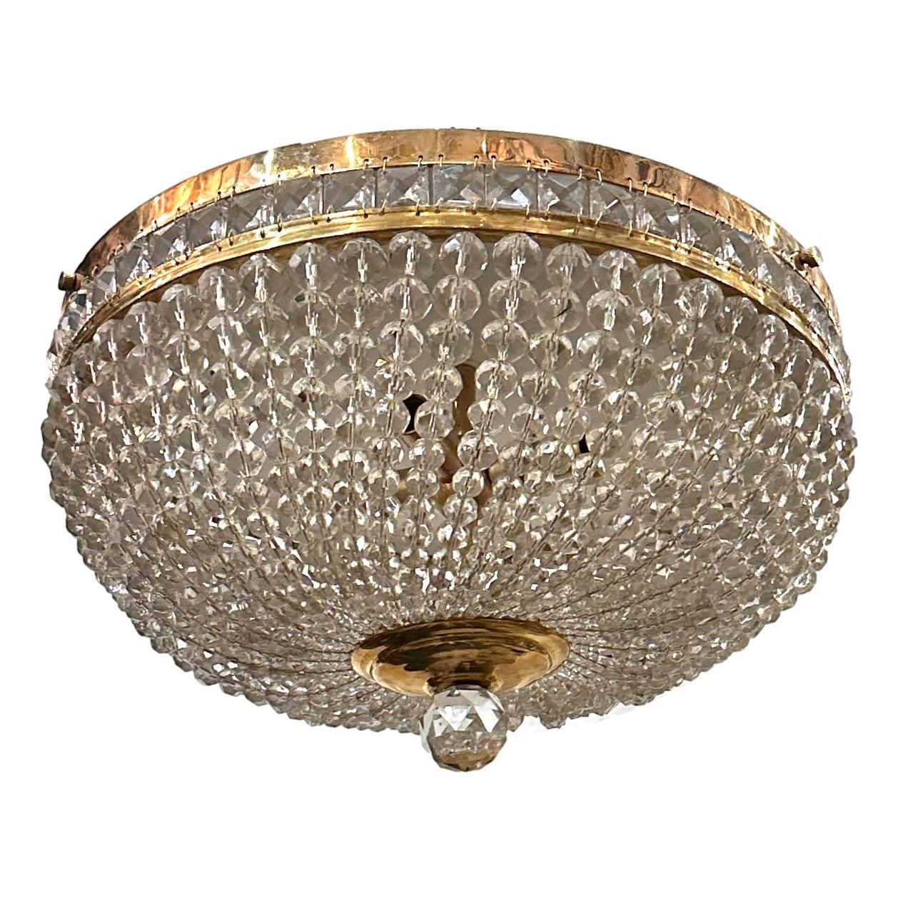 Set of 4 French circa 1950's crystal light fixtures with 4 interior lights.

Measurements:
Drop: 9