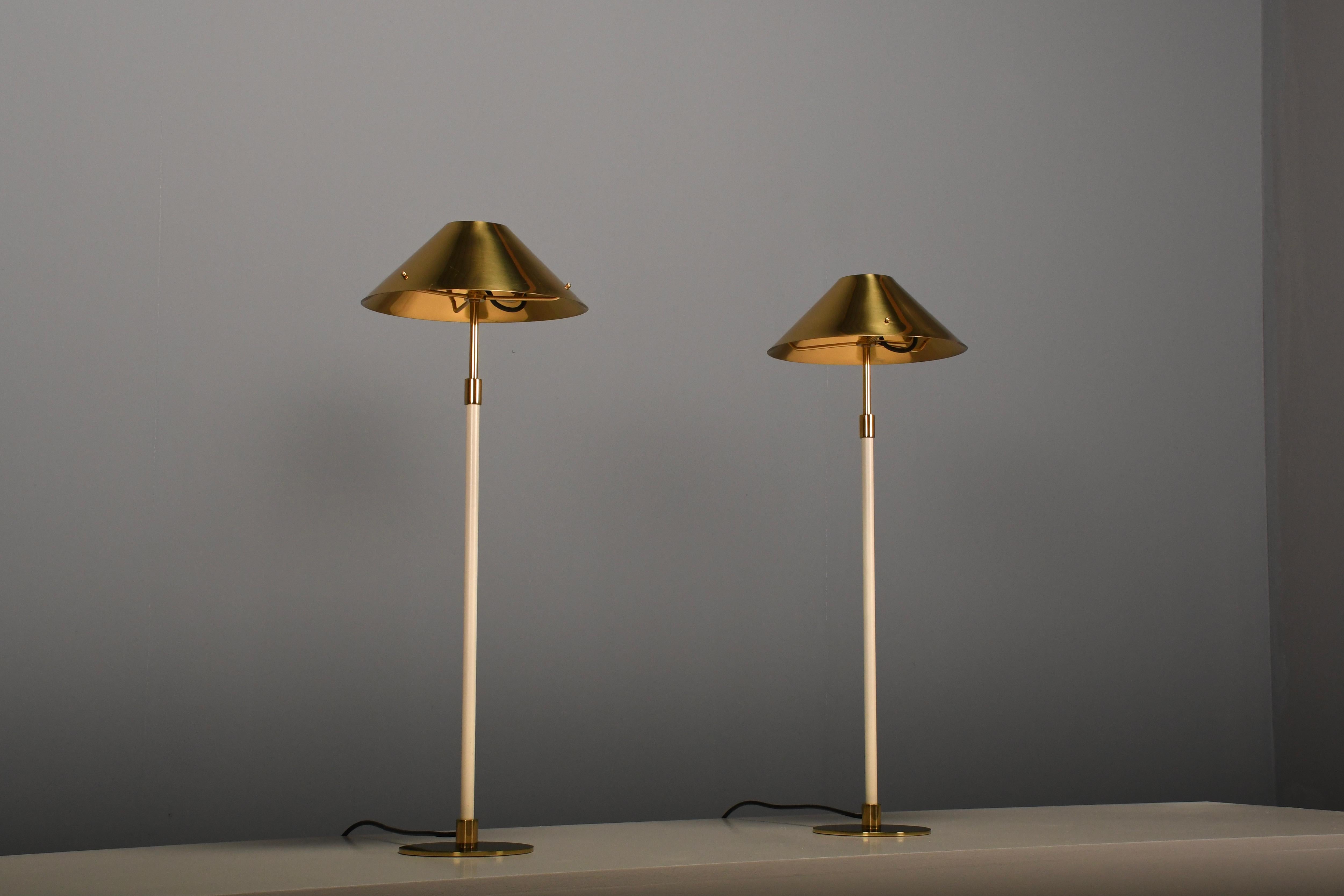 Set of beautiful table lamps in very good condition.

Designed by Mathias Thörner.

This lamps have a very elegant, Scandinavian look and they are very well made. 

The shades are made of thick solid brass and are connected to the lacquered