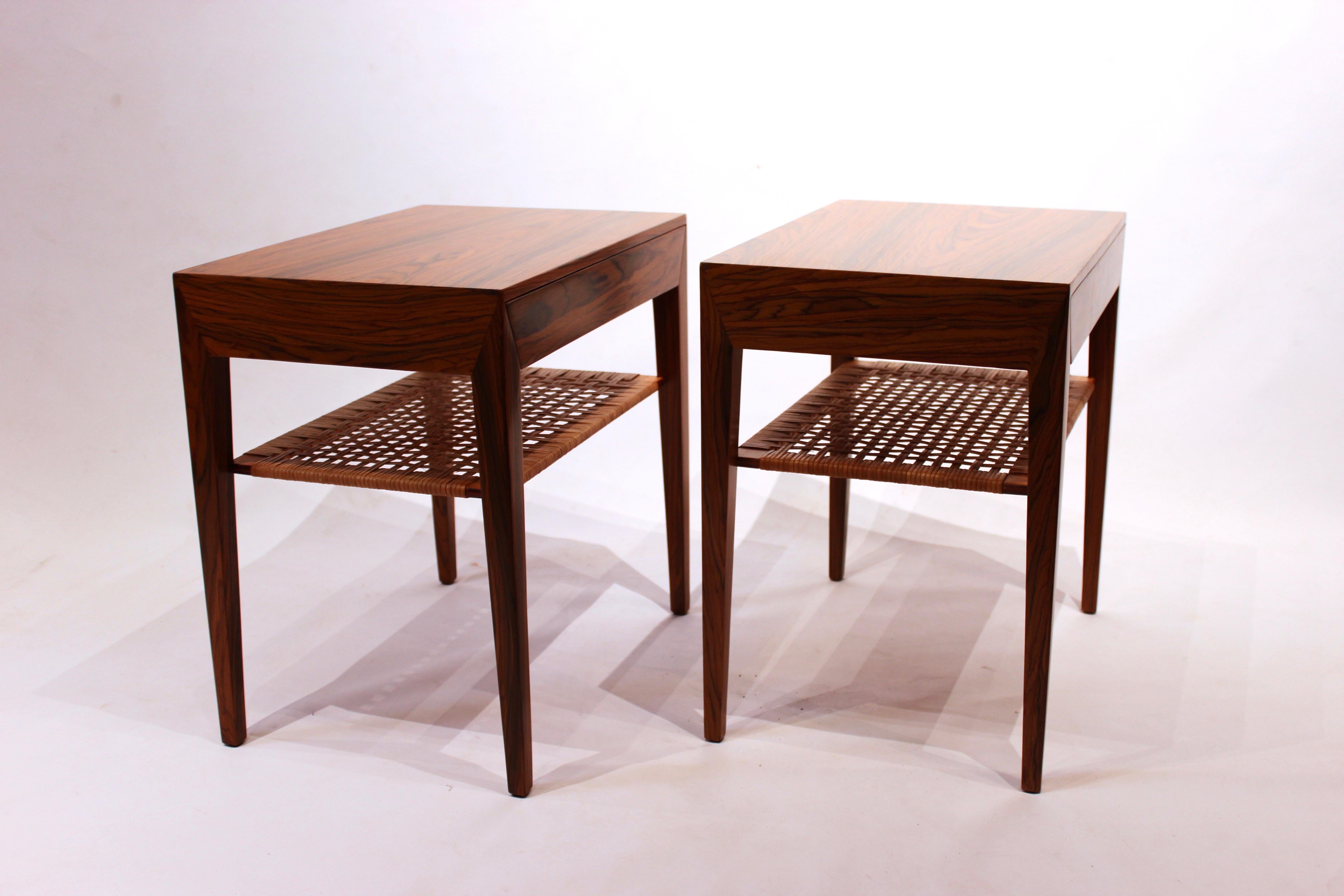 A set of bedside tables in rosewood and papercord shelf designed by Severin Hansen and manufactured by Haslev furniture factory in the 1960s. The tables are in great vintage condition.