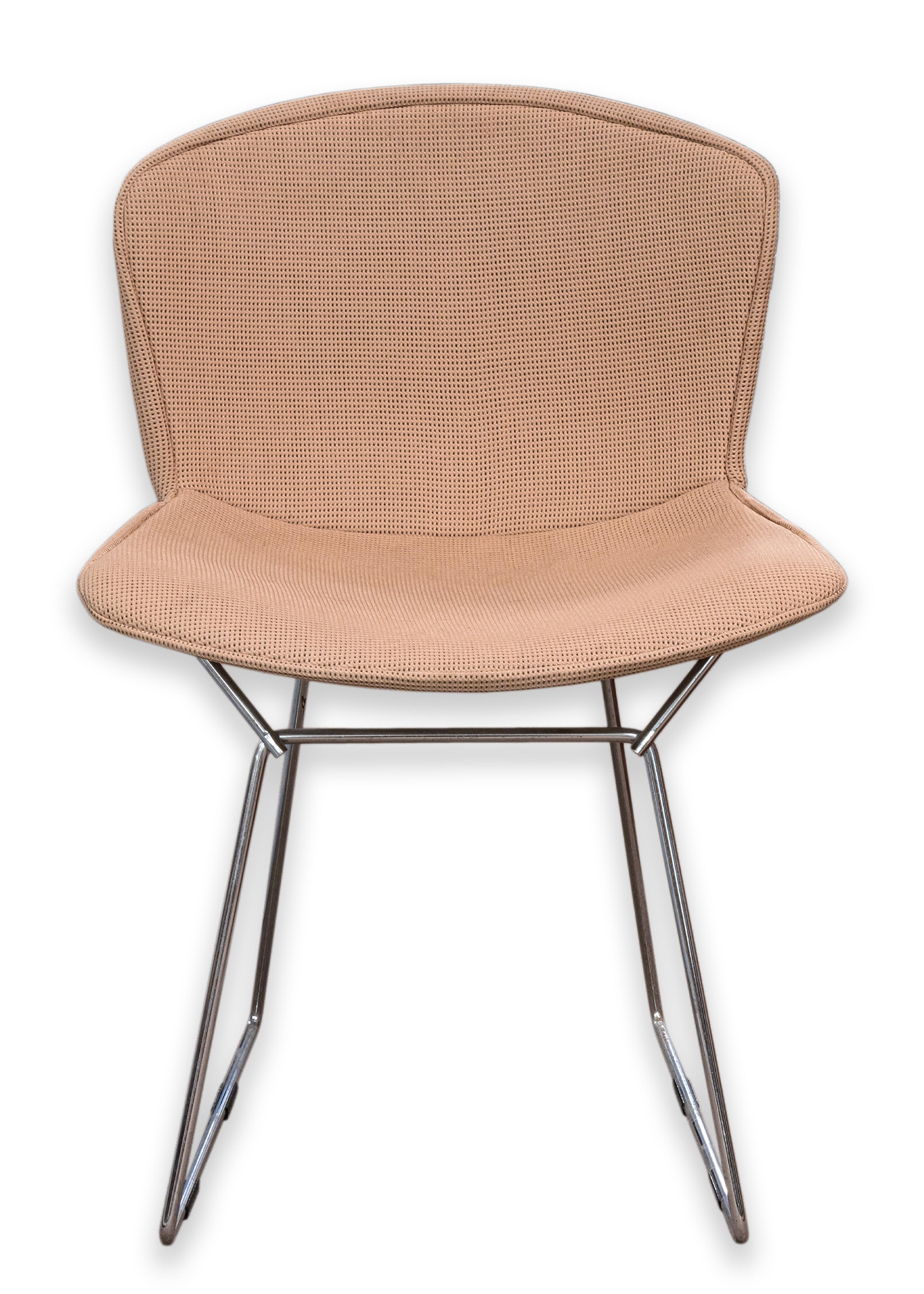 A set of 4 Bertoia Knoll dining chairs with Girard fabric. This is a unique set of mid century modern design chairs. The Bertoia chair is a timeless design with a very versatile style. Even more special, is these chairs are covered in beautiful
