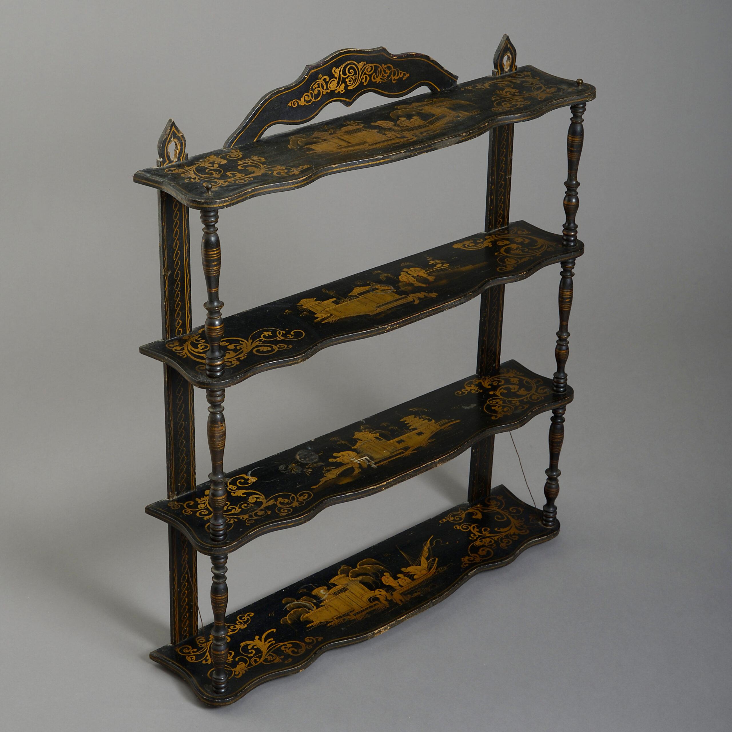 A set of late nineteenth century black japanned and gilded hanging shelves with shaped cresting and spindle side supports.

Circa 1880 England

Dimensions: 26 W x 7 D x 31 H inches
66 W x 18 D x 79 H cm