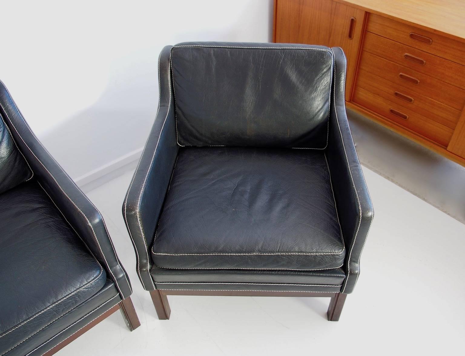 Stained Set of Black Buffalo Leather Sofa and Two Armchairs